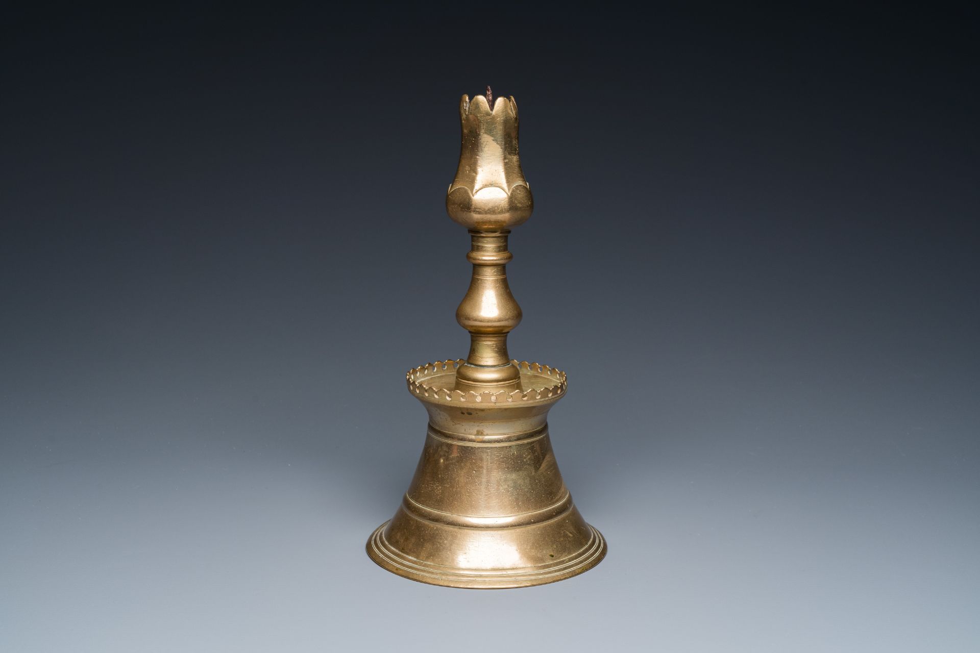 A Turkish bronze candlestick with tulip-shaped sconce, 18th C. - Image 7 of 7