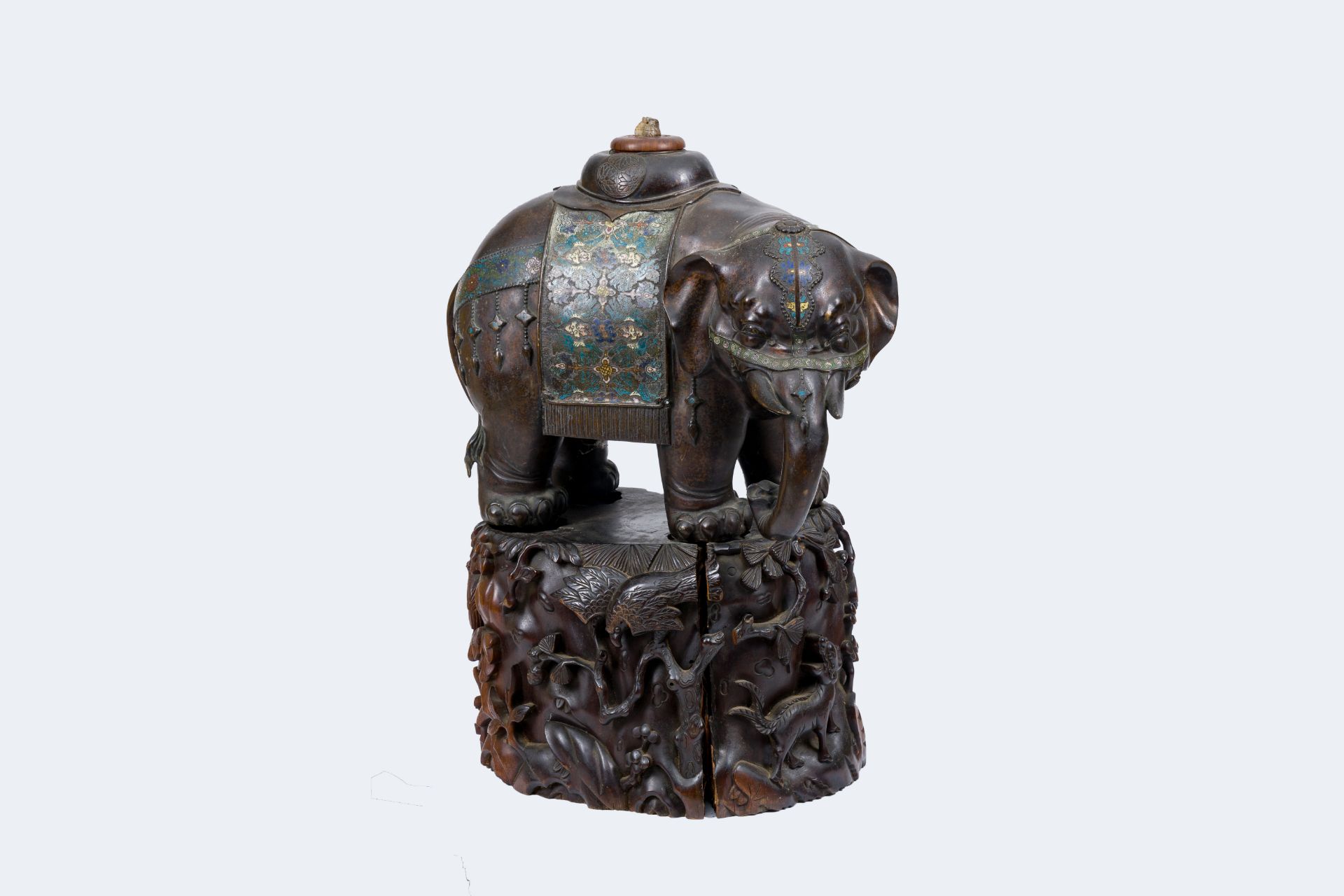 A large Japanese bronze and champleve enamel elephant on a carved wood base, Meiji, 19th C.