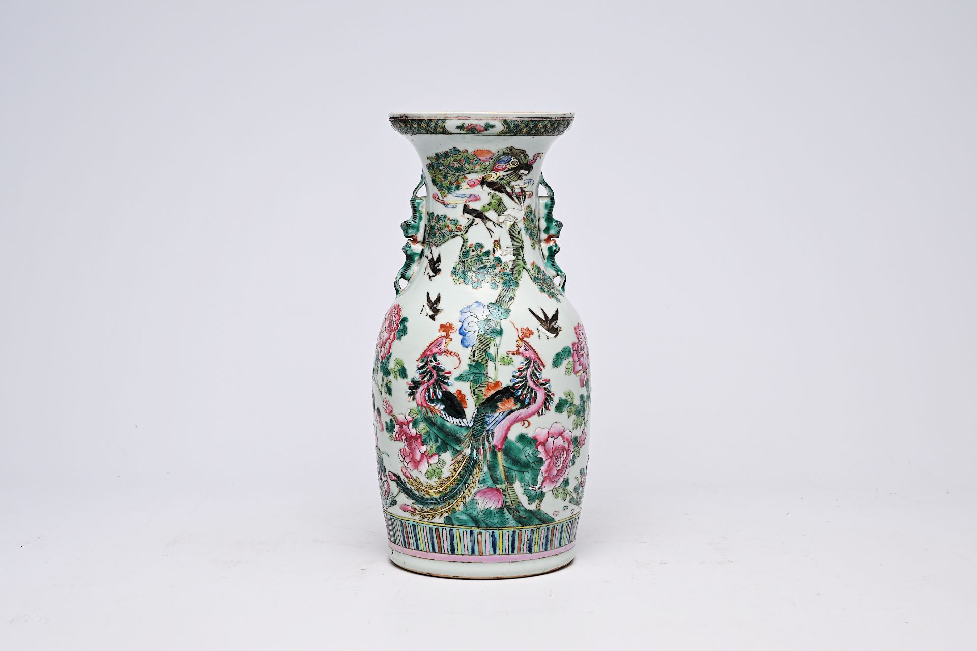 A Chinese famille rose vase with birds among blossoming branches, 19th C.