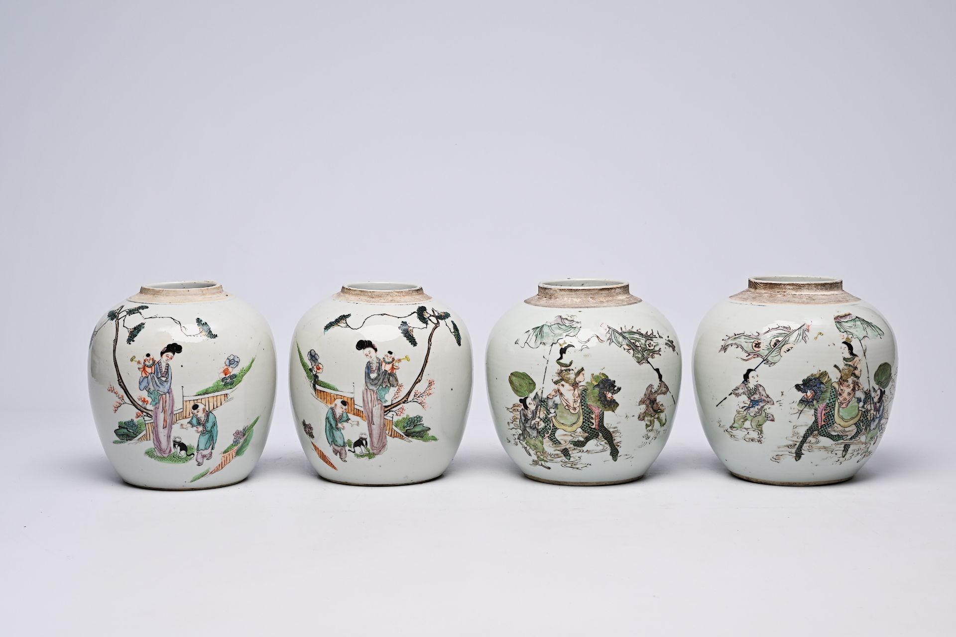 Two pairs of Chinese qianjiang cai jars with the qilin Song Zi and figures in a landscape, 19th/20th