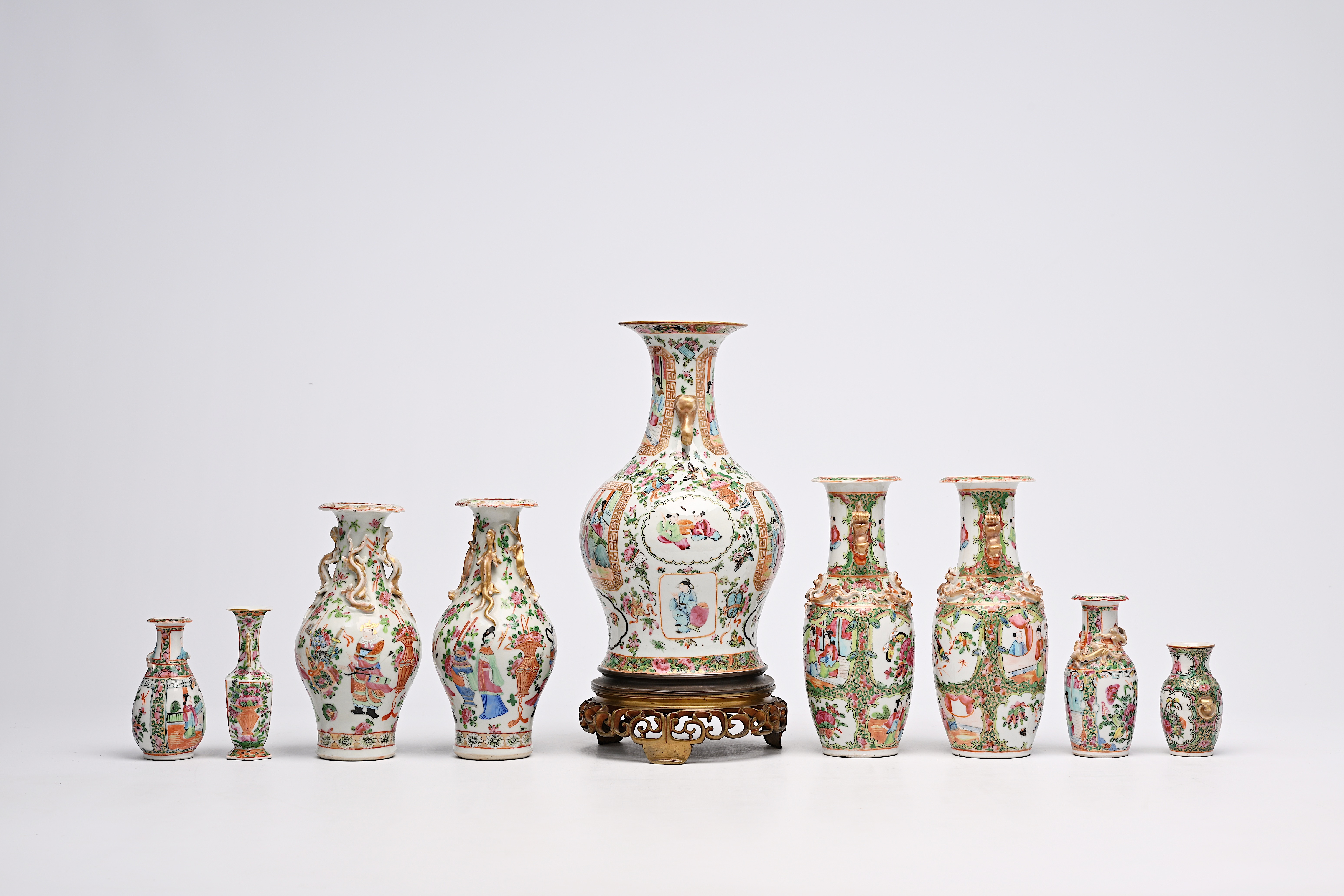 A varied collection of nine Chinese Canton famille rose vases, including two pairs, 19th C. - Image 3 of 8