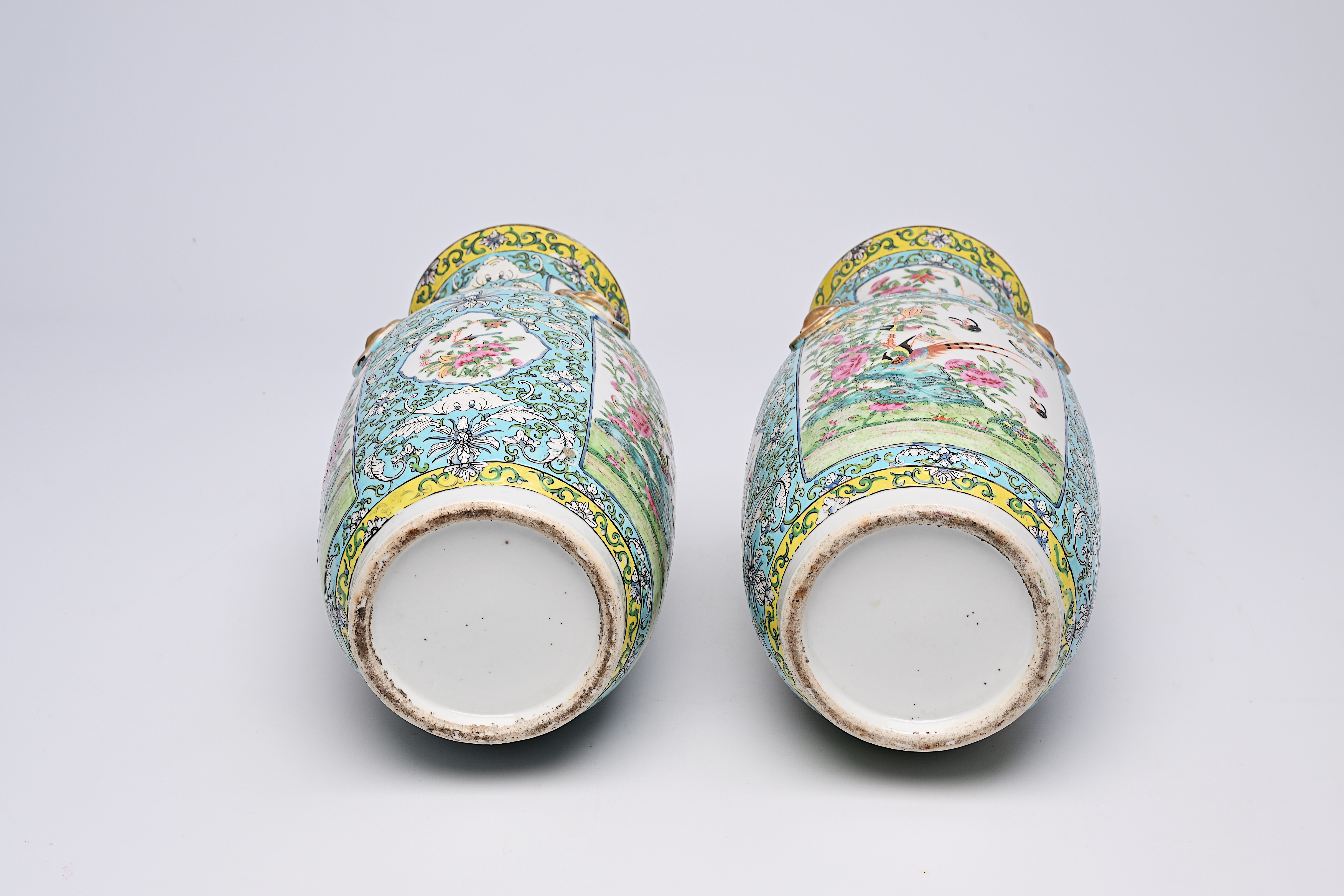 A pair of Chinese Canton famille rose turquoise ground vases with birds and butterflies among blosso - Image 12 of 13