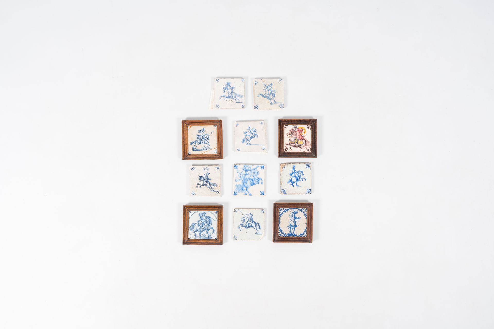 Eleven blue and white and polychrome Dutch Delft tiles with horses and riders, 17th/19th C.