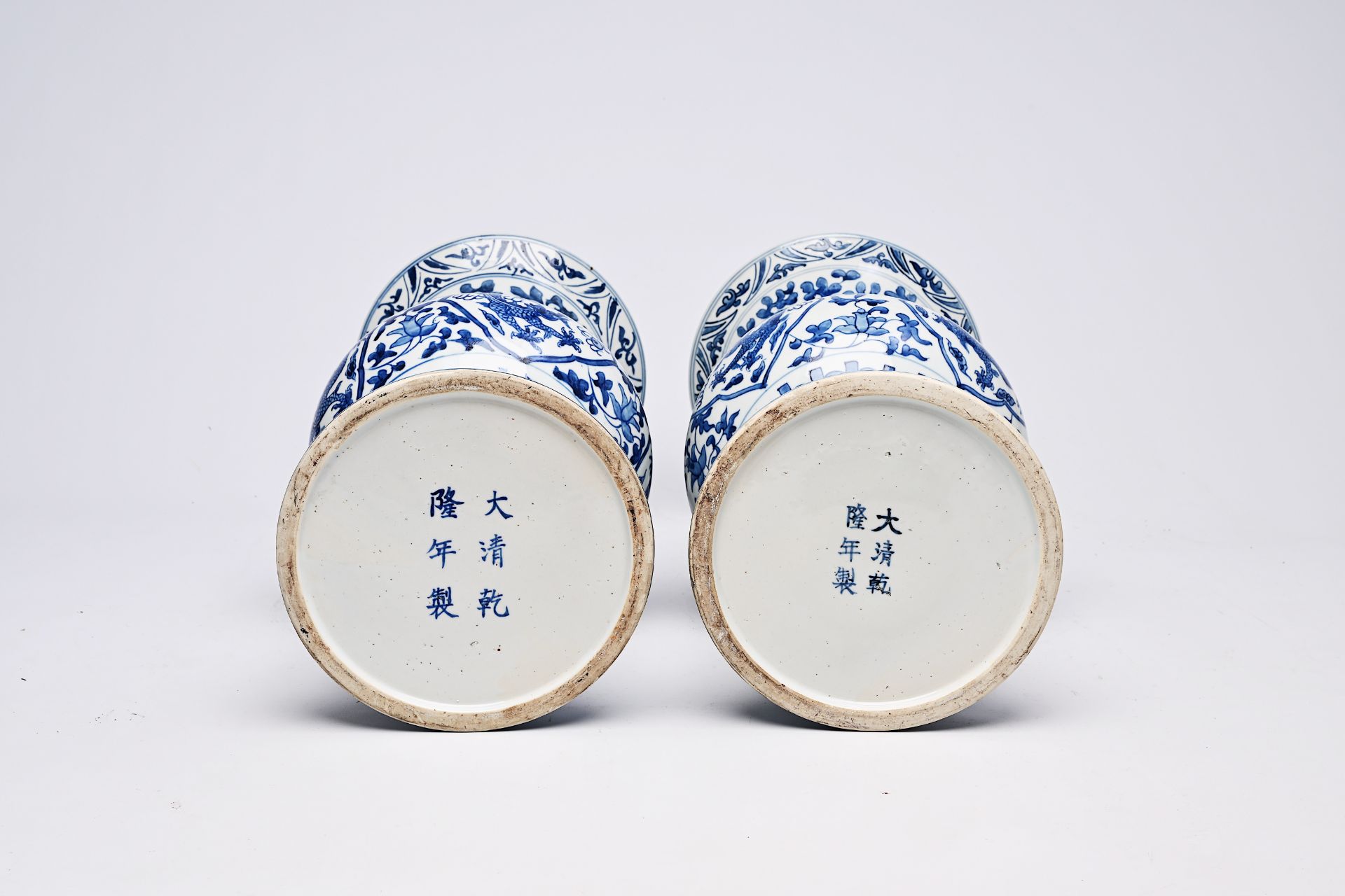 A pair of Chinese blue and white 'gu' vases with dragons and floral design, Qianlong mark, Republic, - Image 22 of 22