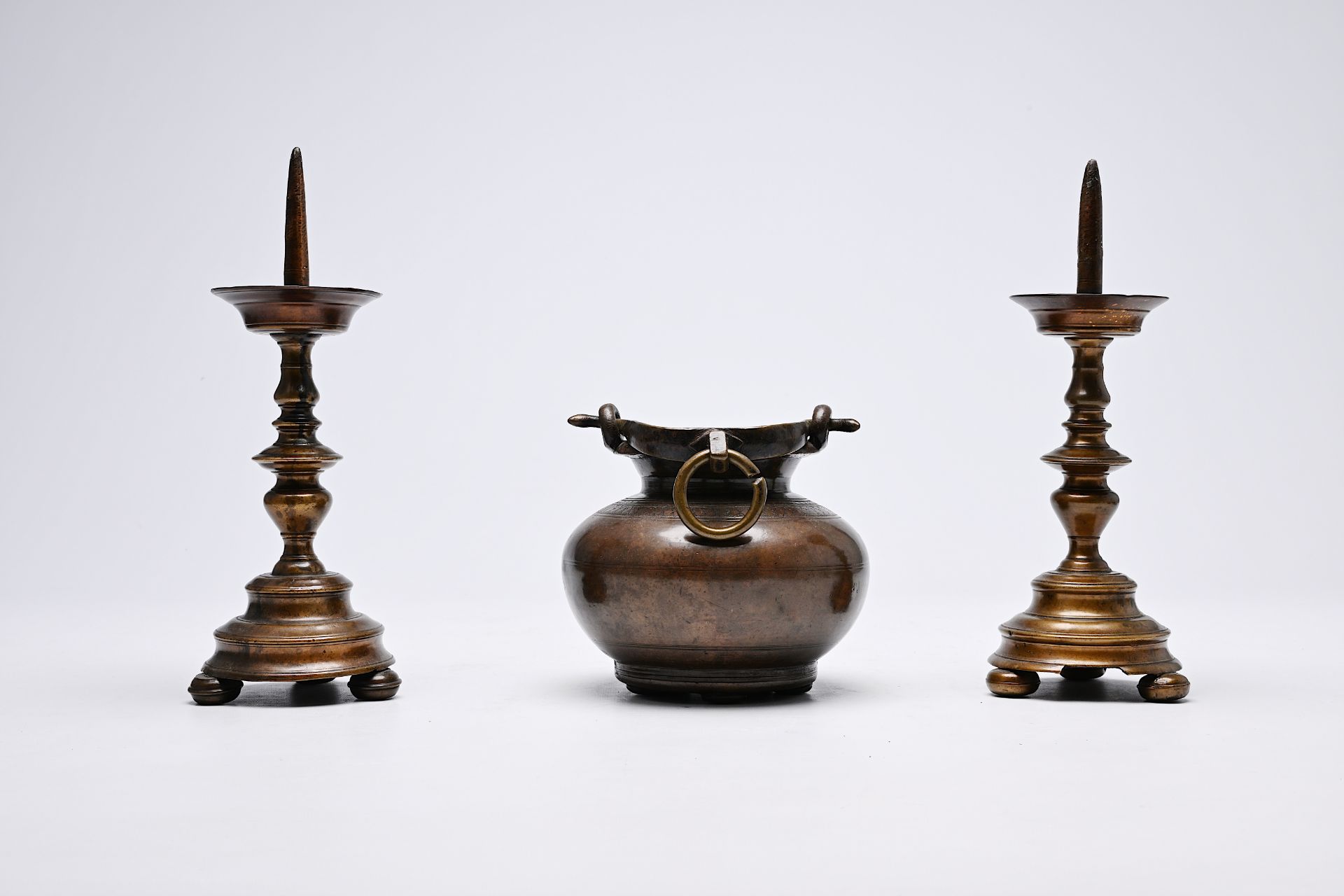 A pair of Italian bronze candlesticks and a holy water bucket, 16th/17th C. - Image 2 of 5