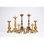 A varied collection of nine brass and bronze candlesticks, Western Europe, 15th C. and later
