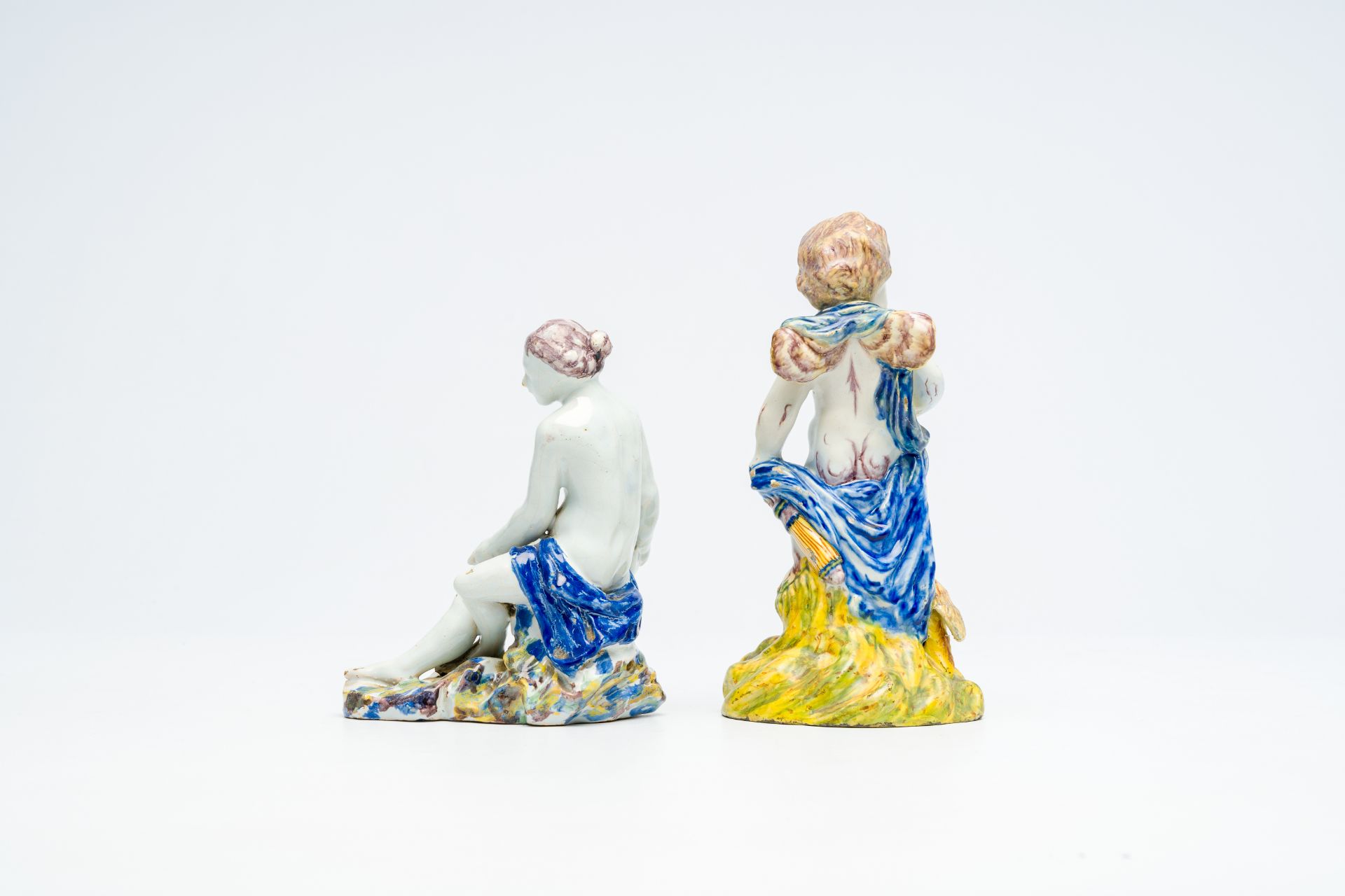 A polychrome 'putto and bird' faience sculpture and a 'lady with a shell' salt cellar, Delft or Brus - Image 3 of 7