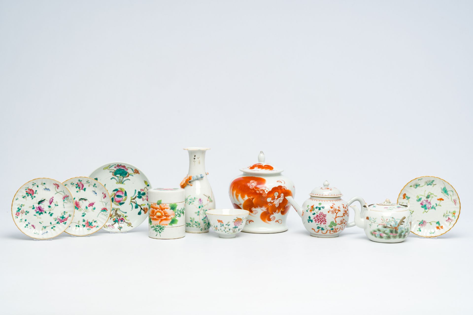 A varied collection of Chinese famille rose and iron-red porcelain with Buddhist lions and floral de