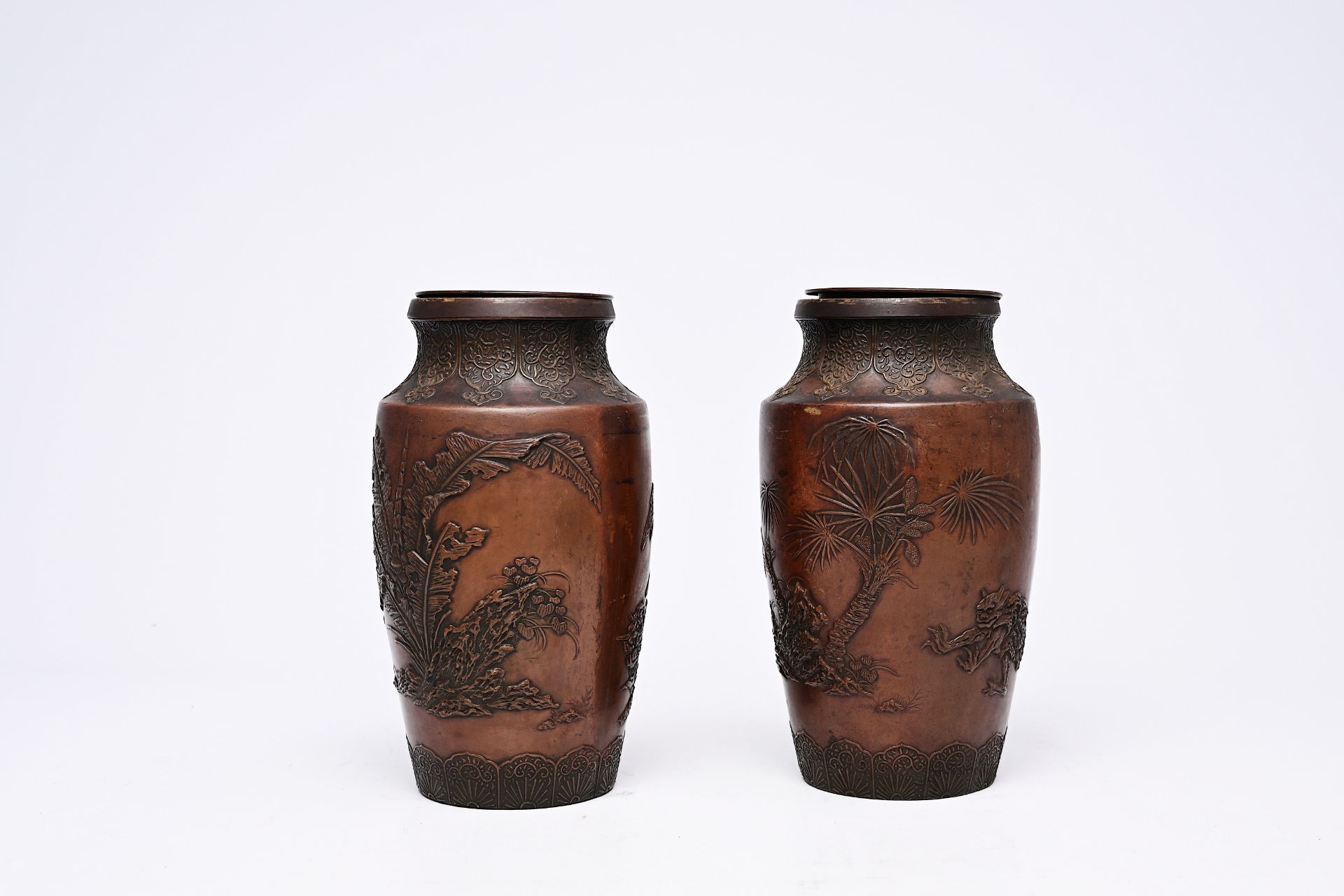 A pair of Japanese bronze vases with relief design of demons in a landscape, Meiji, 19th/20th C. - Image 3 of 7