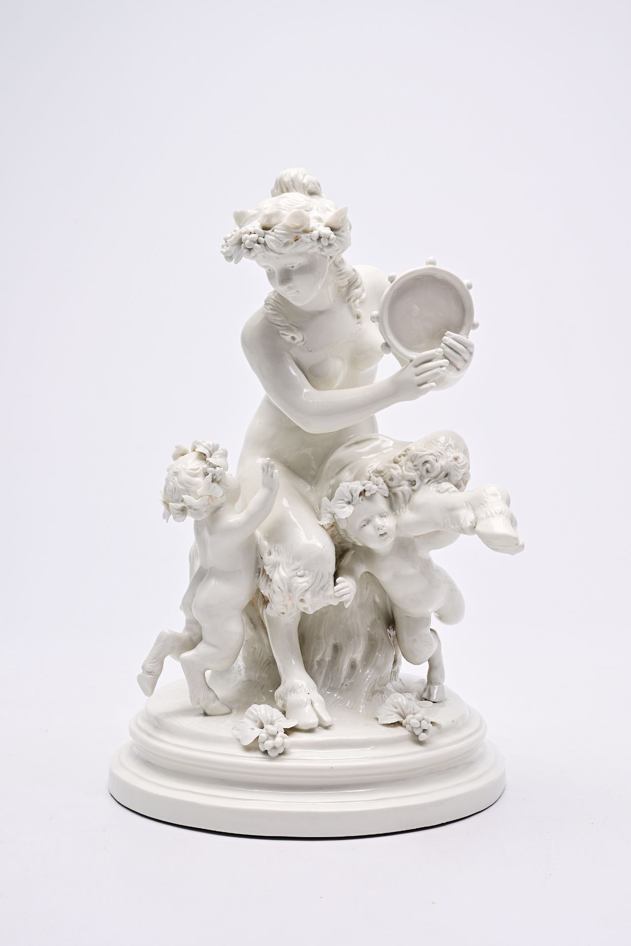 Clodion (1738-1814, after): An Italian playful porcelain group with music-making and dancing satyrs,