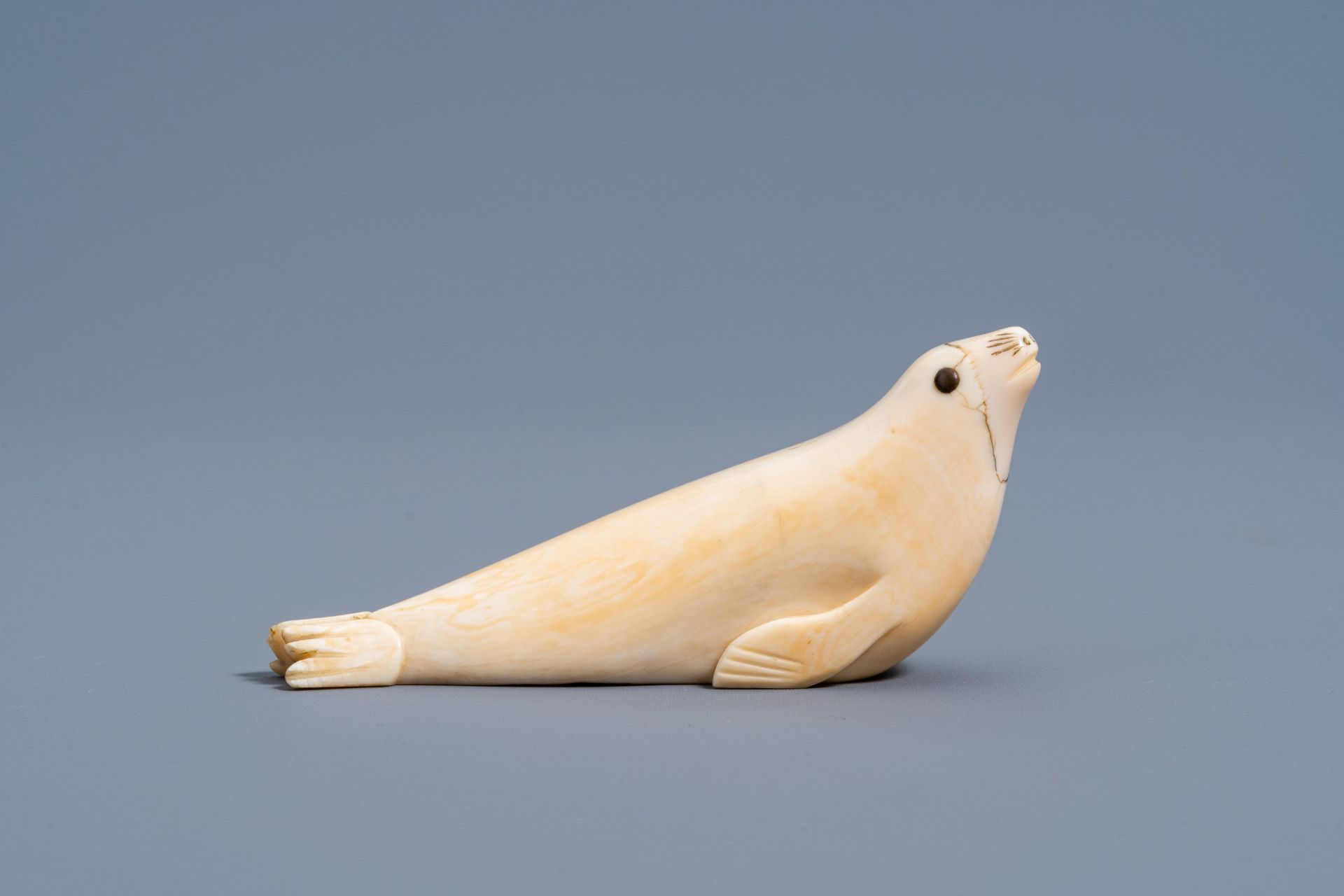 An Inuit carved whale ivory figure of a seal, Canada or Alaska, 19th C. - Image 3 of 11