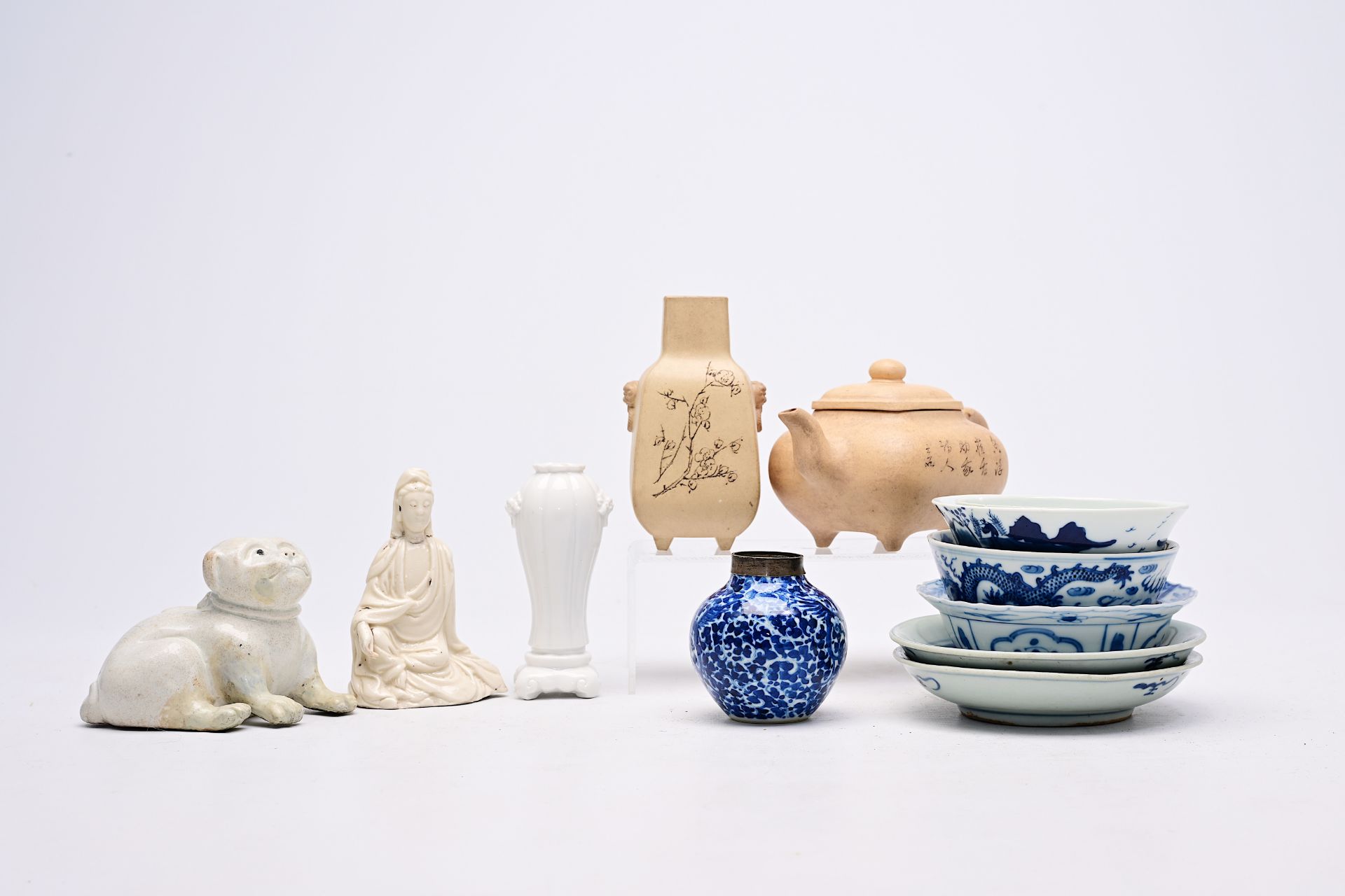 A varied collection of Chinese Yixing stoneware, blue and white and blanc de Chine porcelain, Wanli