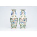 A pair of Chinese Canton famille rose vases with palace scenes, auspicious symbols and mythical anim