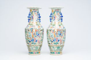 A pair of Chinese Canton famille rose vases with palace scenes, auspicious symbols and mythical anim