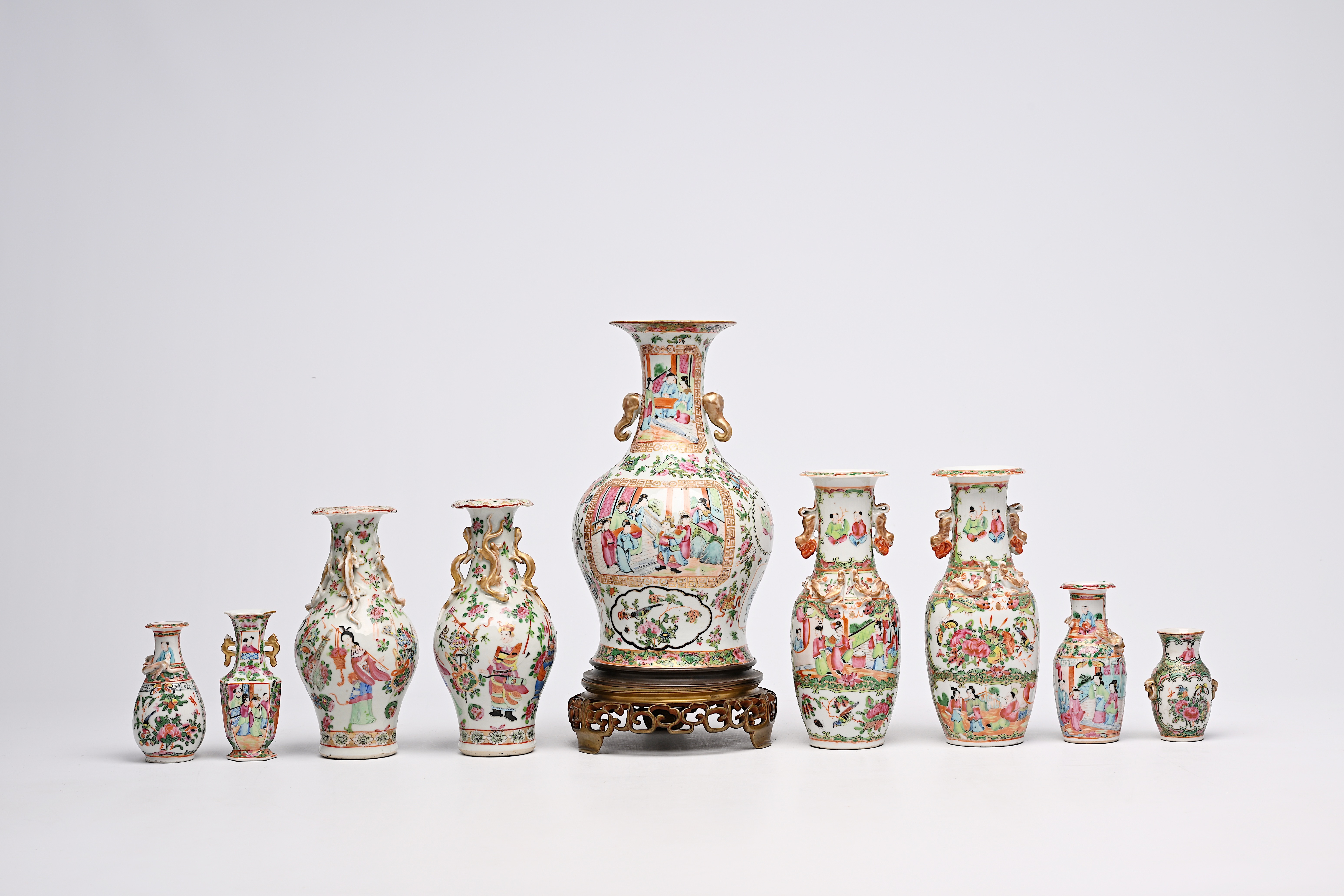 A varied collection of nine Chinese Canton famille rose vases, including two pairs, 19th C. - Image 4 of 8