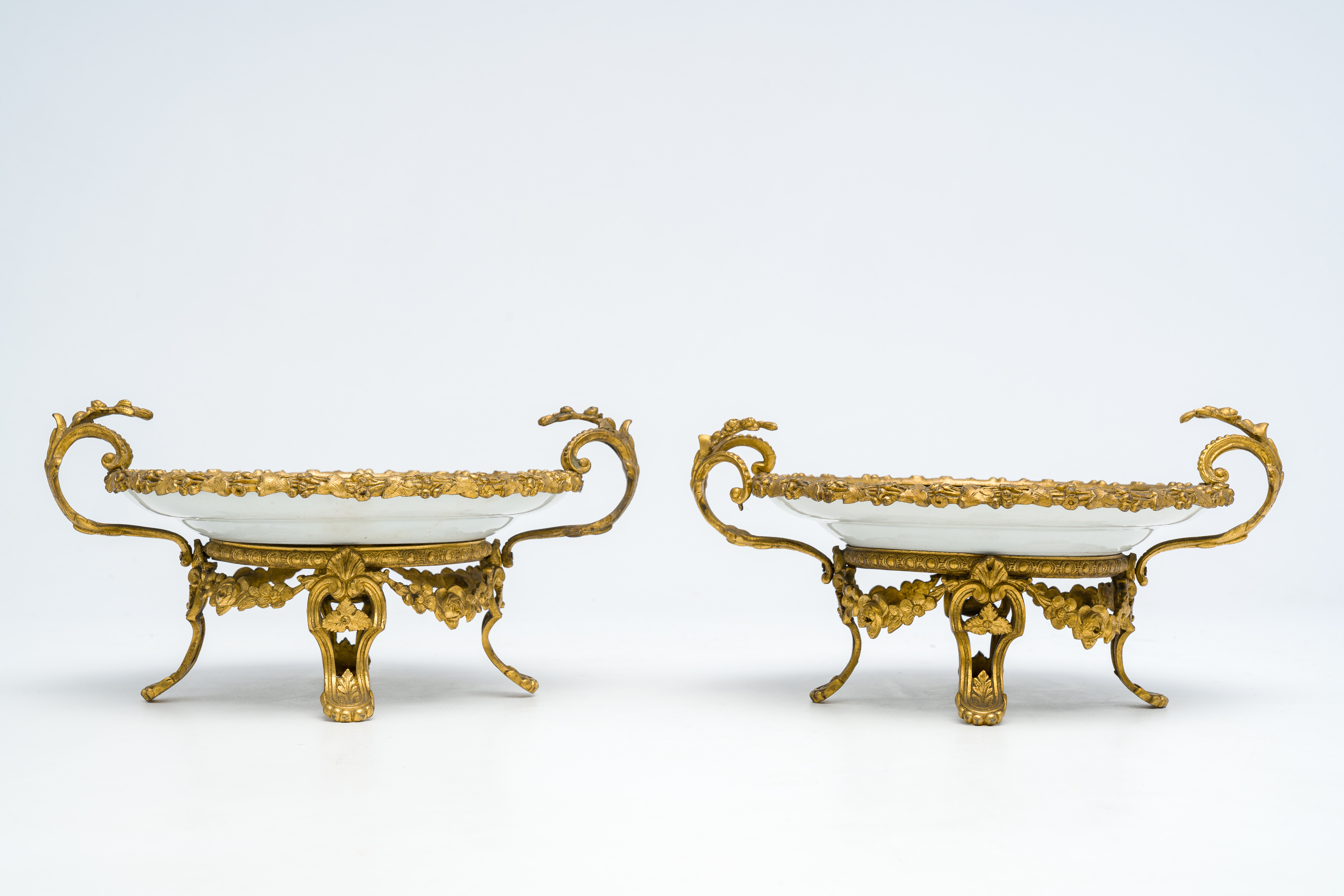 Two Chinese Canton famille rose gilt bronze mounted plates with figures on a terrace, 19th C. - Image 6 of 7