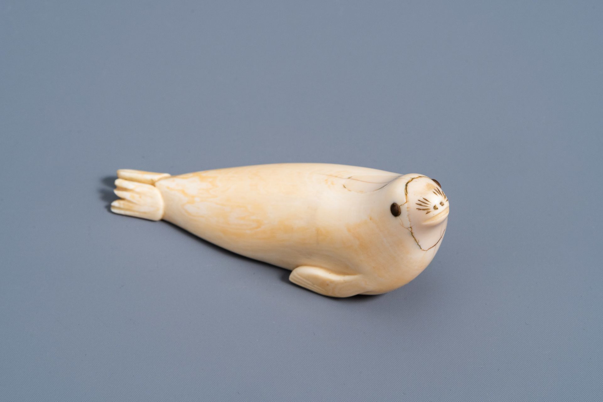 An Inuit carved whale ivory figure of a seal, Canada or Alaska, 19th C. - Image 10 of 11