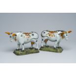 A pair of Dutch Delft partly cold-painted polychrome cows, 18th C.