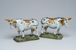 A pair of Dutch Delft partly cold-painted polychrome cows, 18th C.