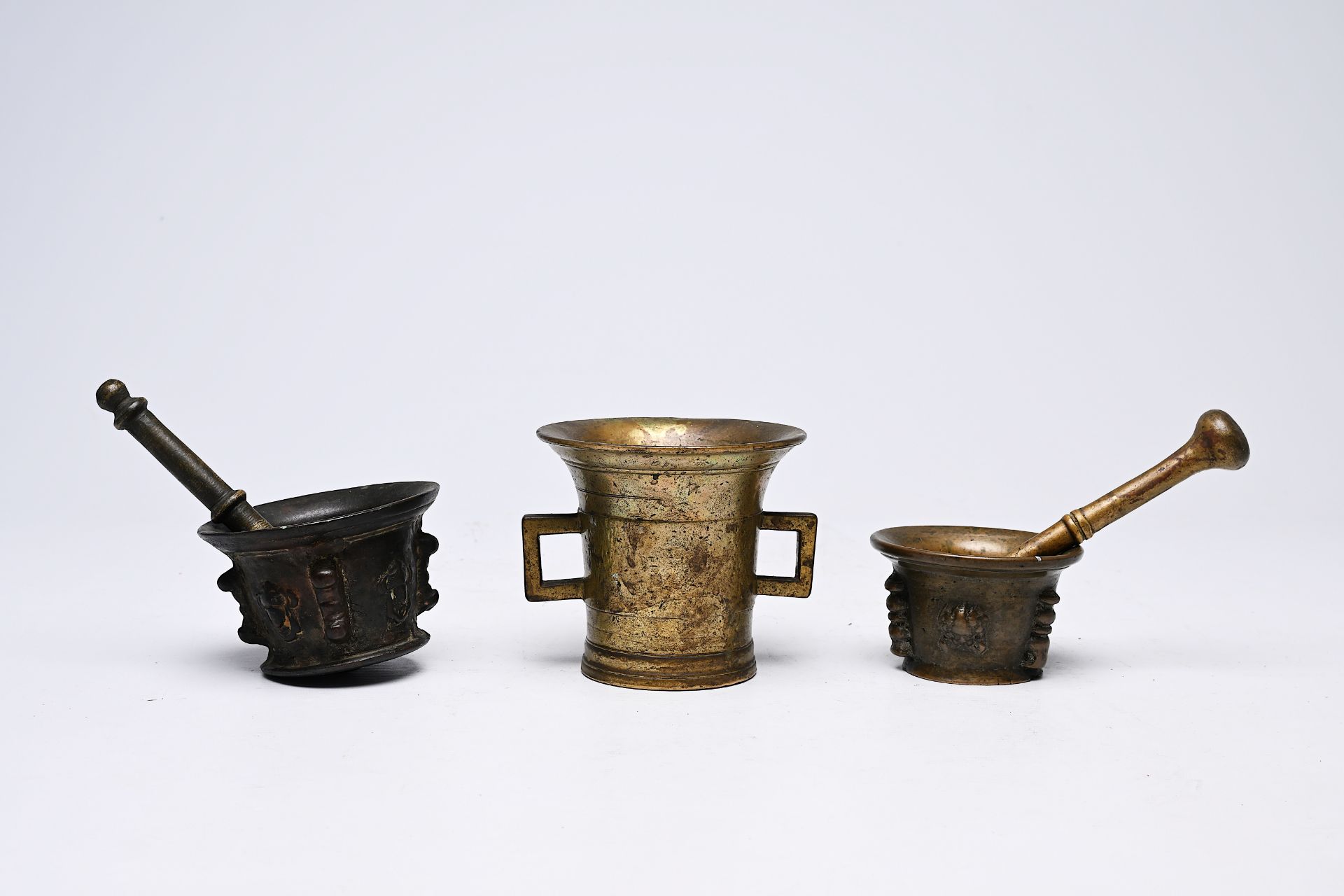 Three bronze mortars and two pestles, France and/or Spain, 16th/17th C.