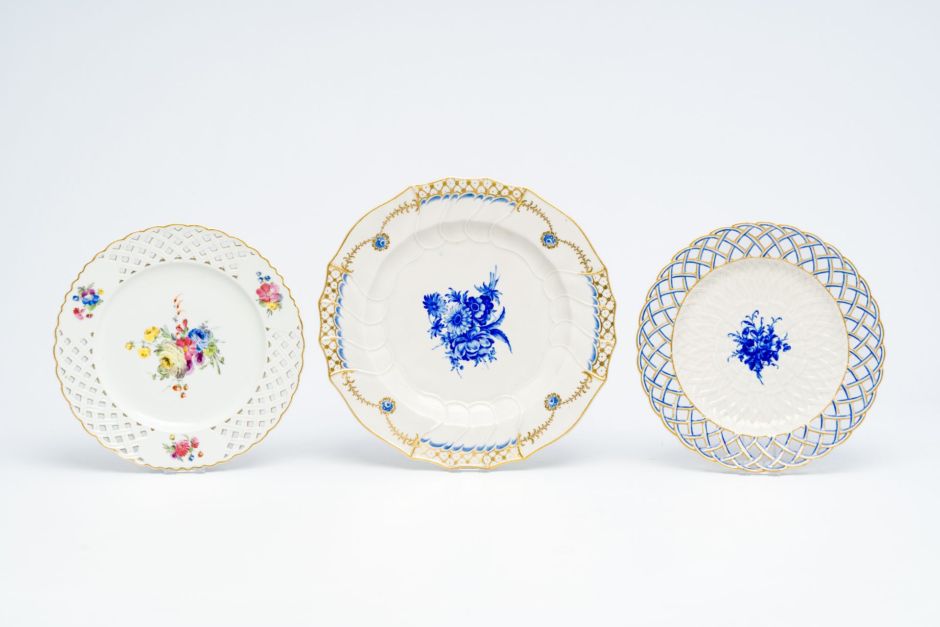 Three polychrome porcelain plates with floral design, Tournai and The Hague, 18th C. - Image 2 of 3