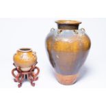 Two Chinese stoneware martaban jars with incised and applied design, 19th C.