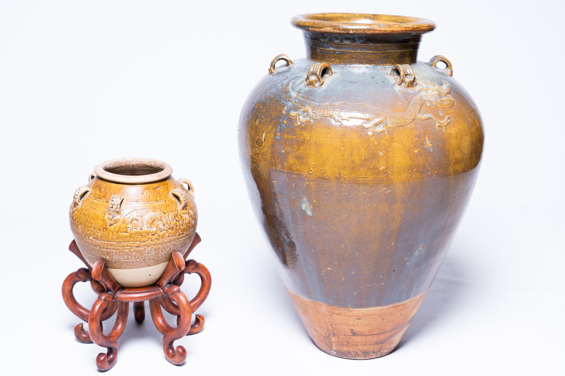 Two Chinese stoneware martaban jars with incised and applied design, 19th C.