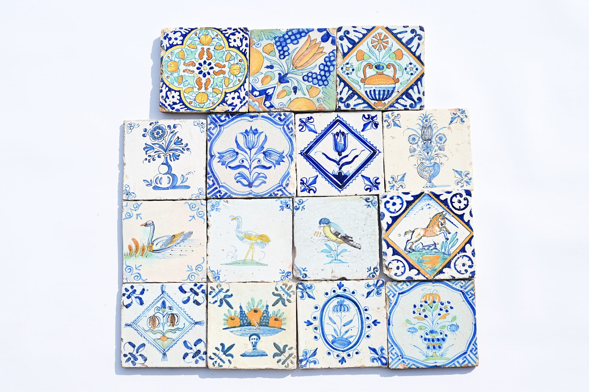 Seventeen blue and white and polychrome Dutch Delft tiles, 17th C.