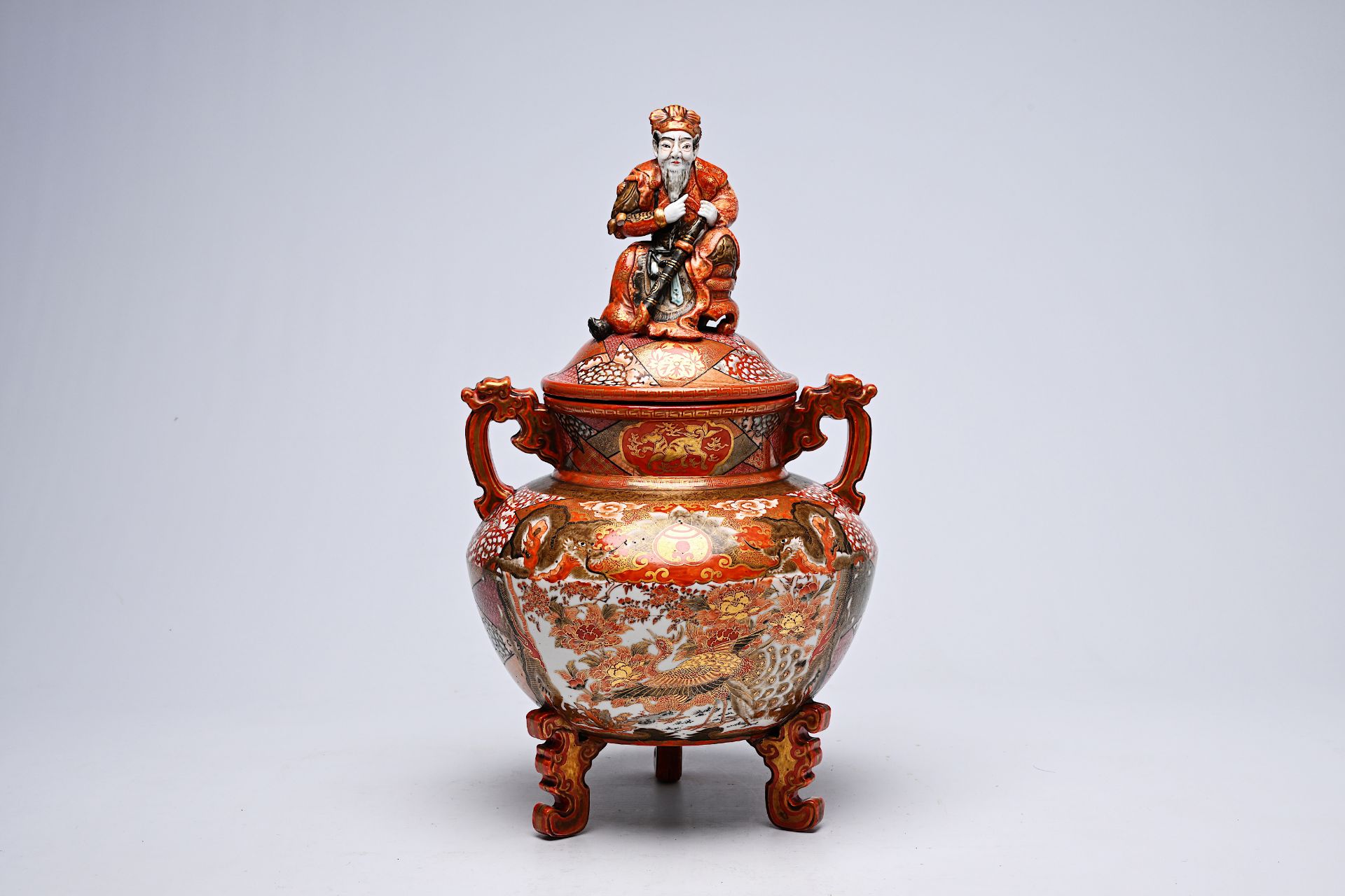 A Japanese Kutani incense burner crowned with an Immortal with ladies in a landscape, dragons and bi