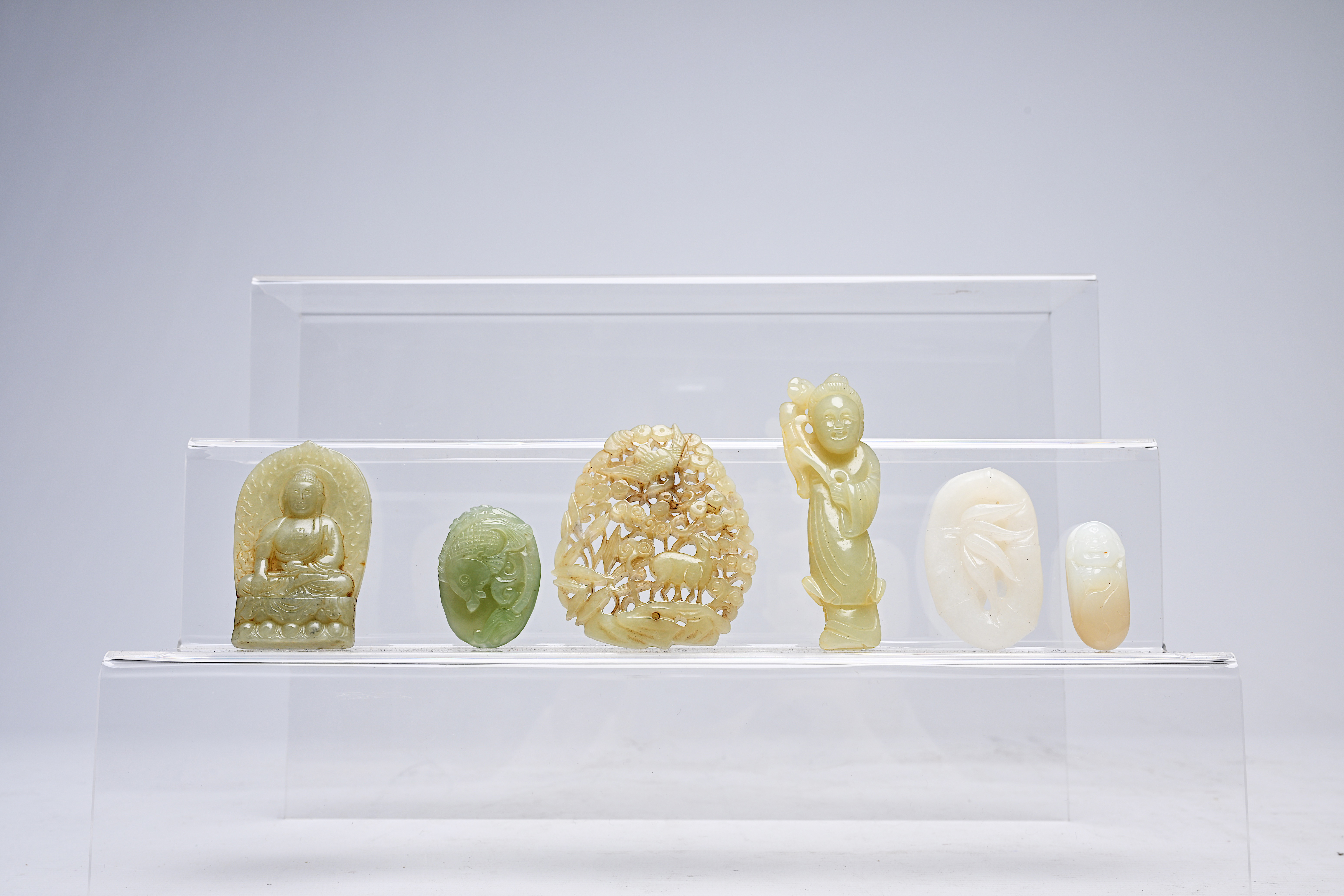 Six Chinese white and celadon jade carvings, 19th/20th C.