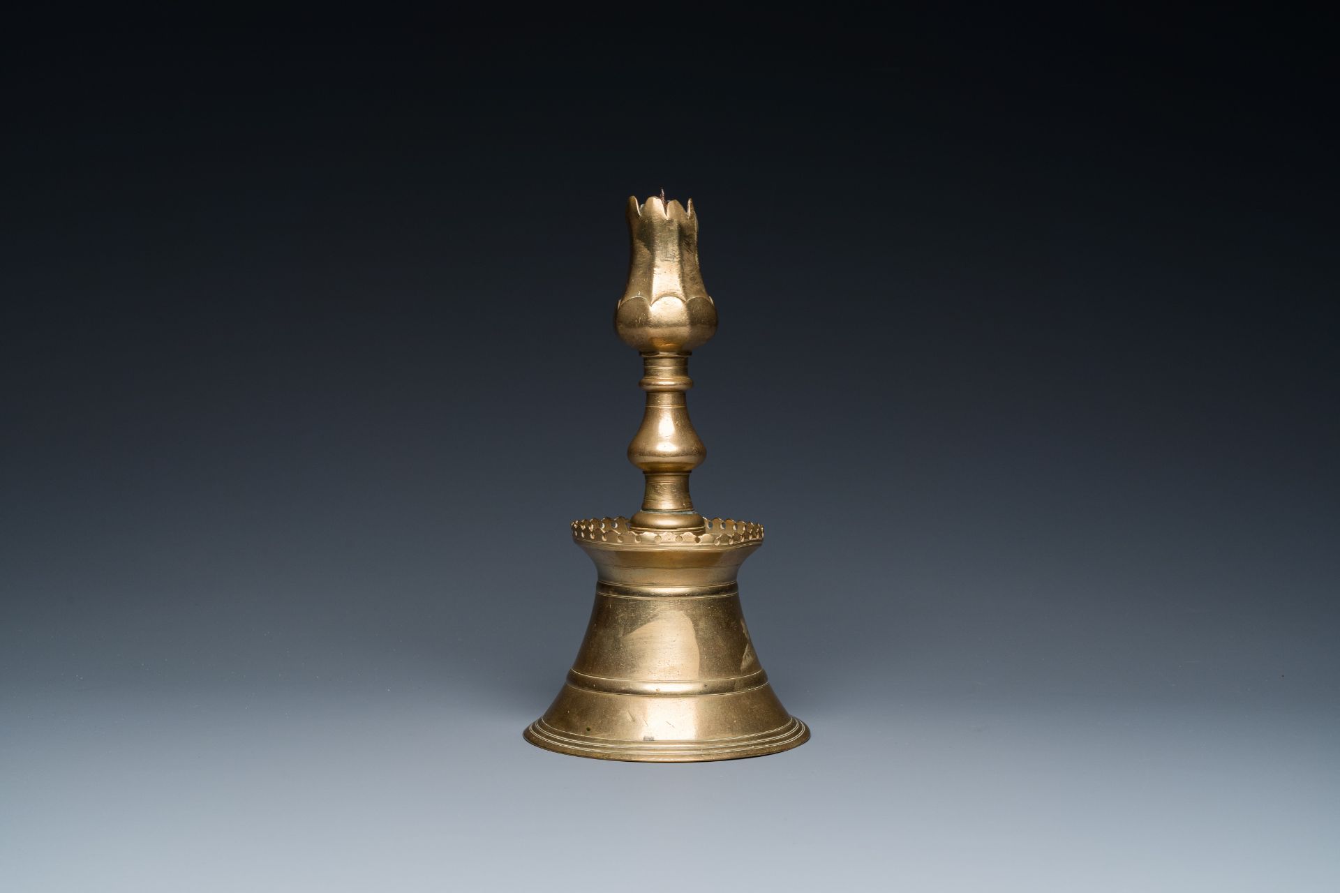 A Turkish bronze candlestick with tulip-shaped sconce, 18th C. - Image 2 of 7