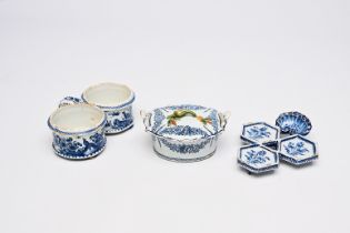 A Dutch Delft blue and white butter tub, an oil and vinegar holder and a spice dish with floral desi