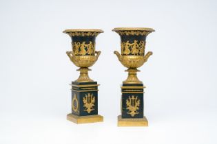 A pair of French patinated and gilt bronze 'Campana' urns in the style of Thomire, 19th/20th C.