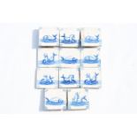 Eleven Dutch Delft blue and white 'sea monster' tiles, 19th C.