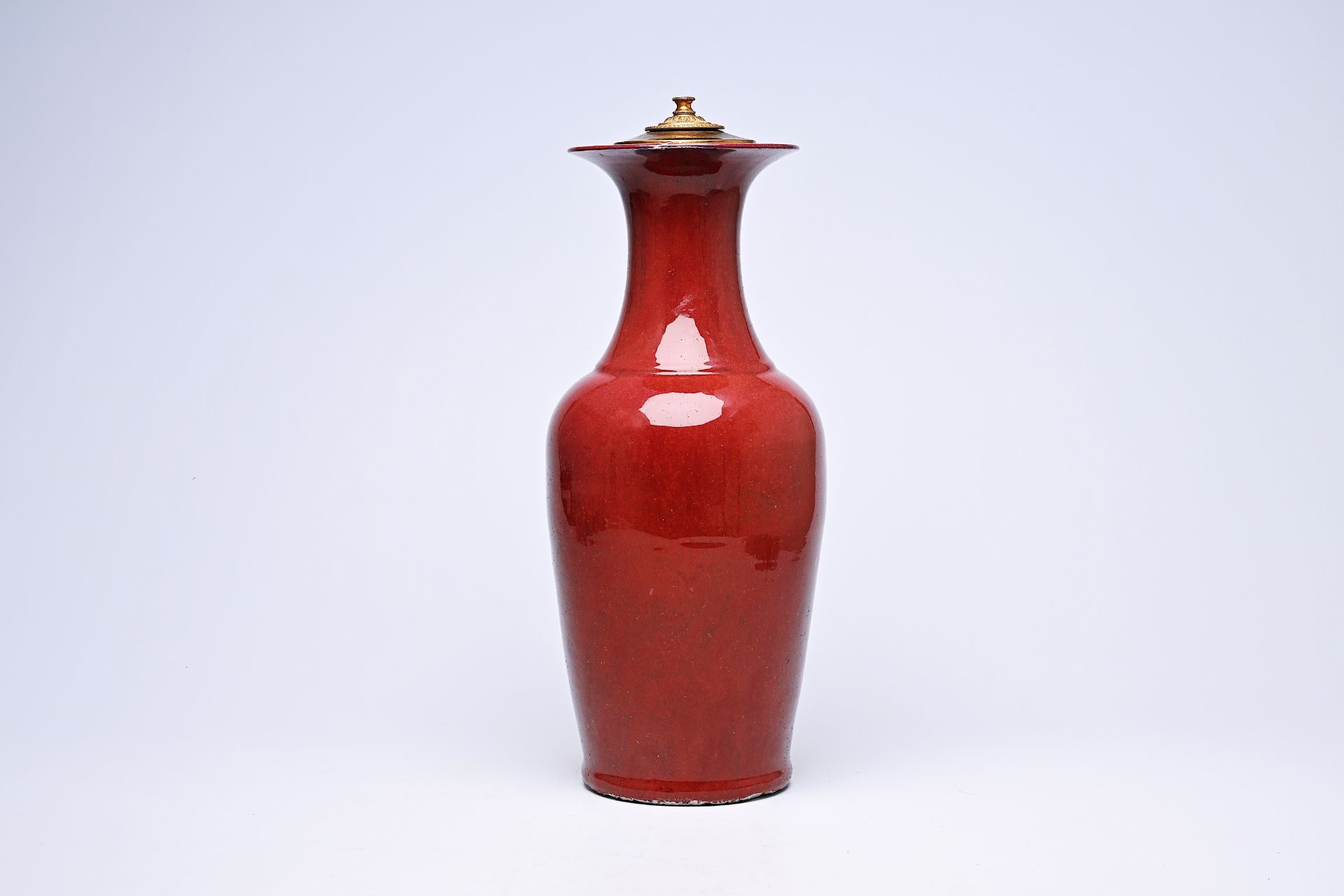 A Chinese monochrome sang-de-boeuf glazed vase mounted as a lamp, 19th C.