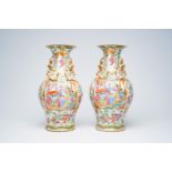 A pair of Chinese Canton famille rose vases with palace scenes, floral design and antiquities, 19th