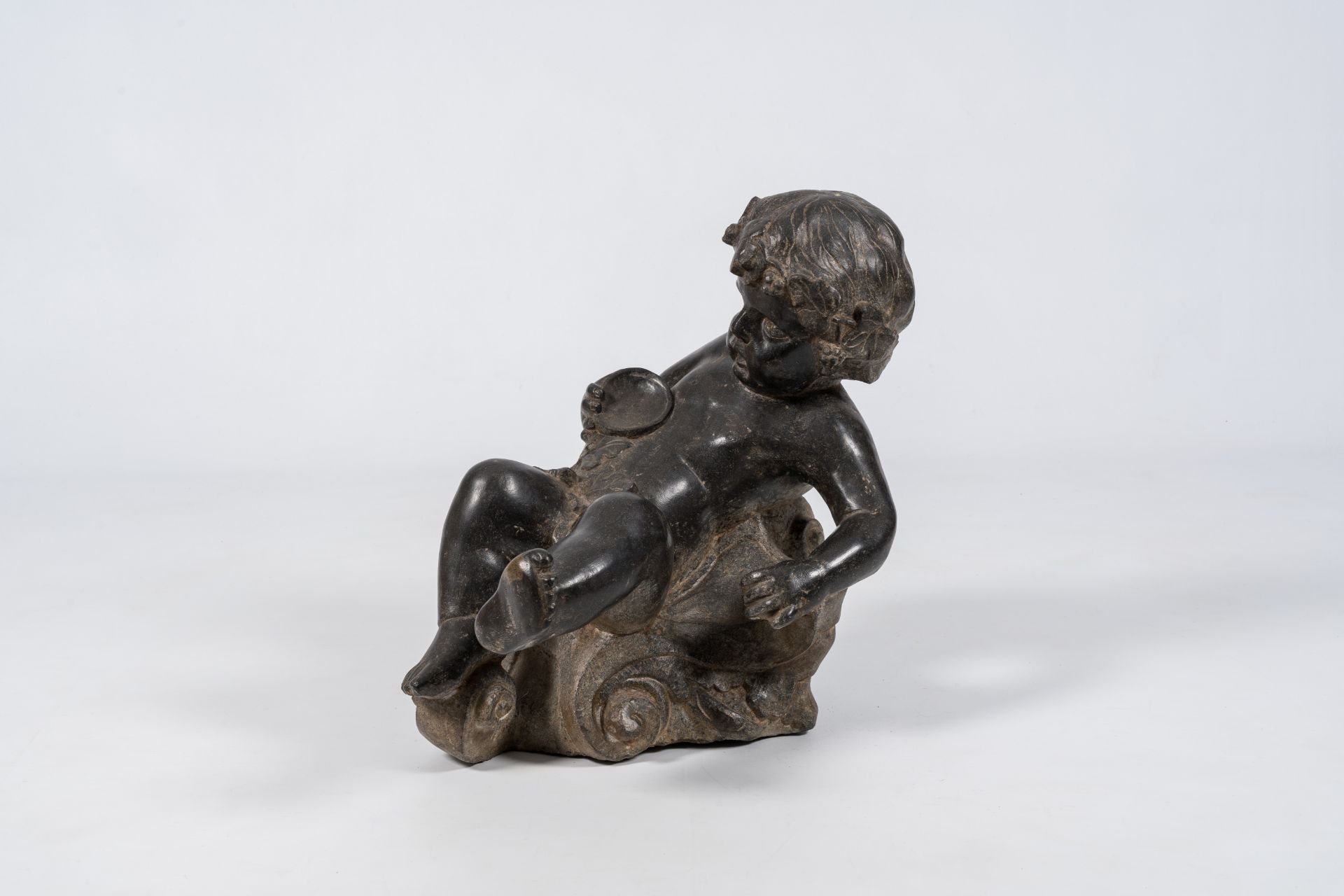 An Italian stone figure of a drunken bacchant, 19th/20th C.