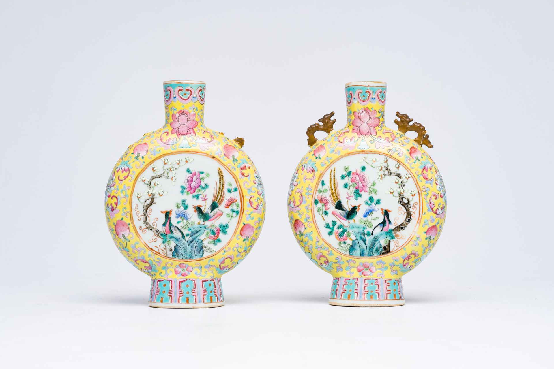 A pair of Chinese famille rose yellow ground moon flasks with warrior scenes and pheasants among blo - Bild 4 aus 8