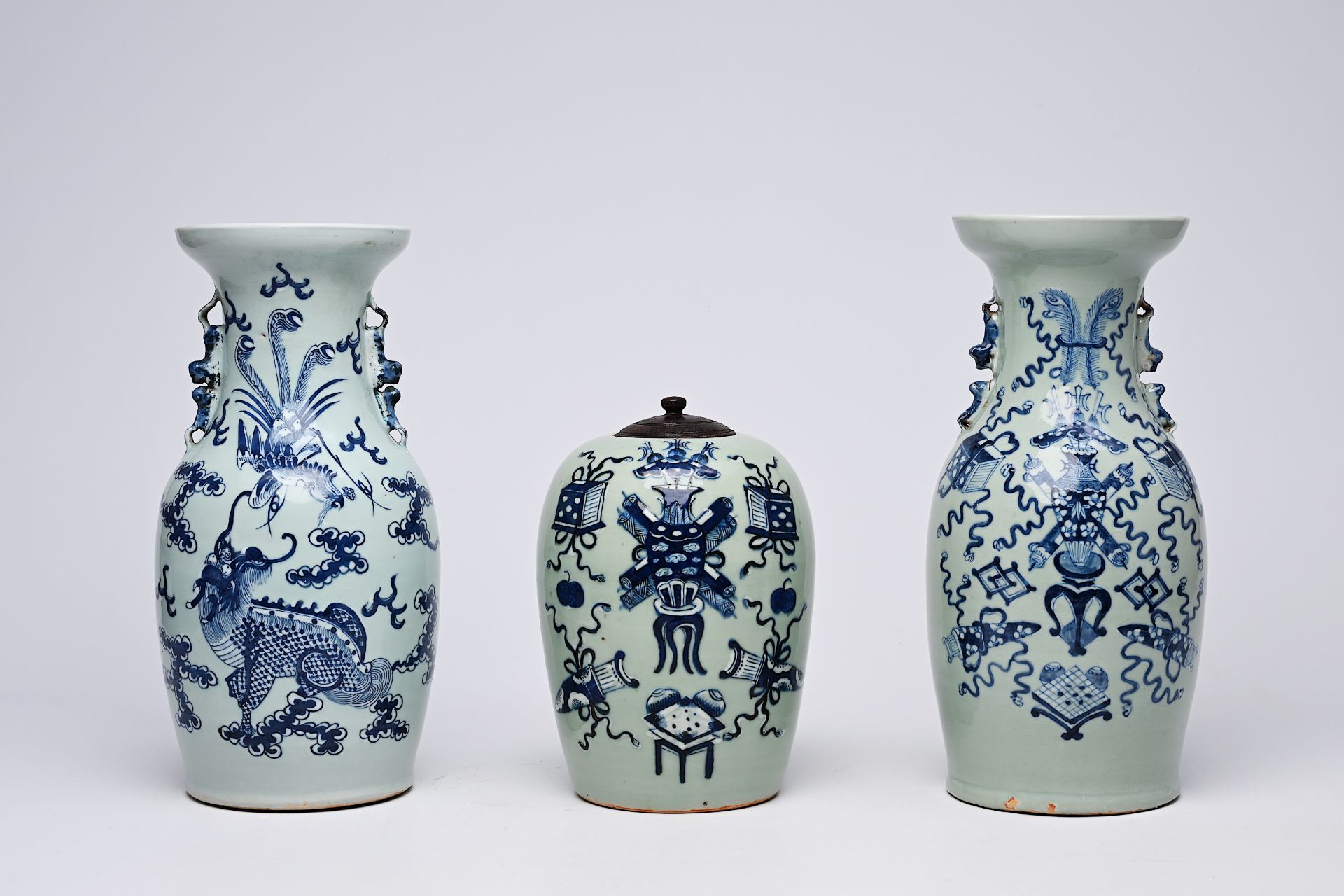 Two Chinese blue and white celadon ground vases and a ginger jar with antiquities, a dragon and a ph