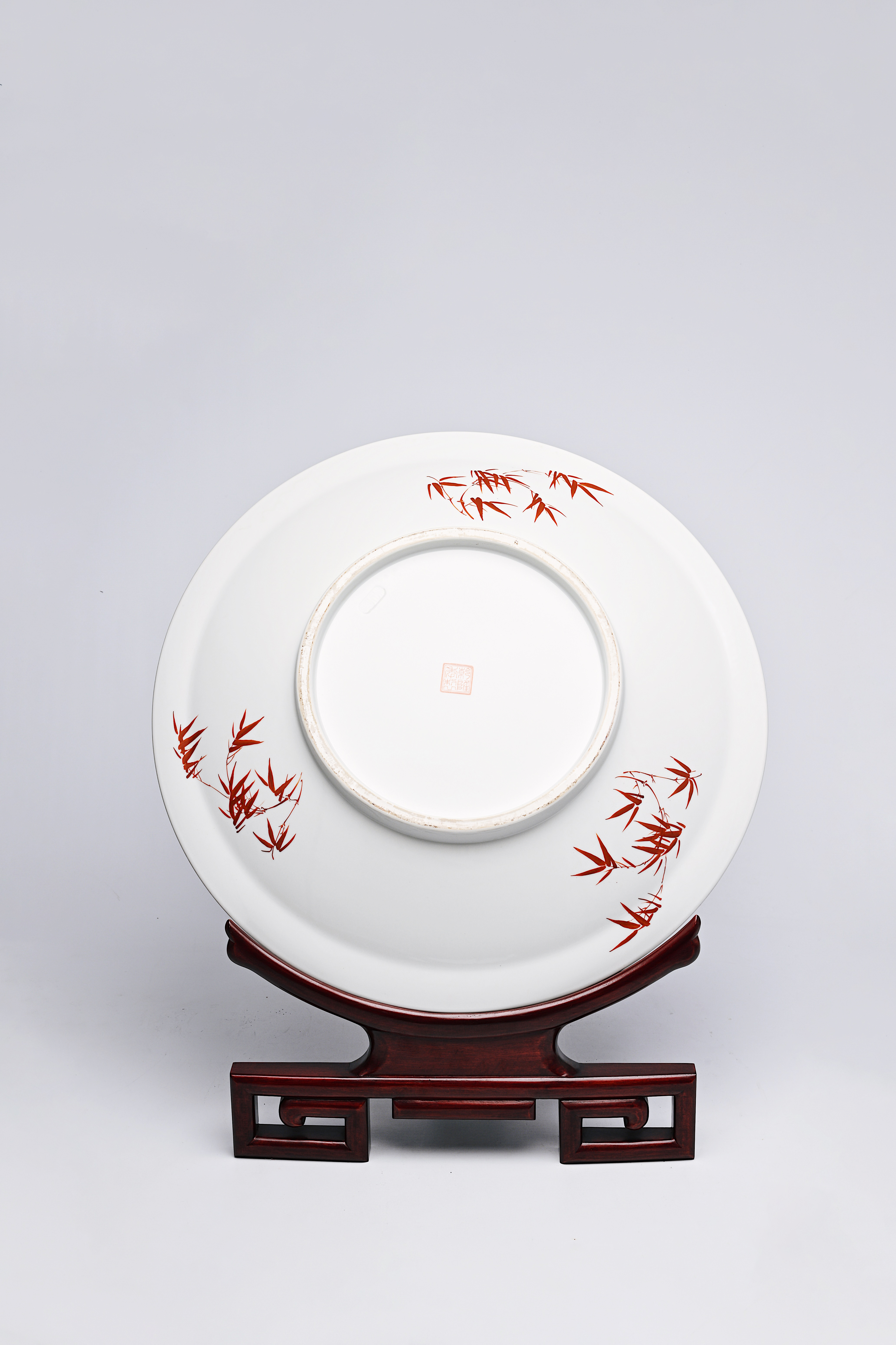 A large Chinese famille rose dish with ladies and children in a landscape, Qianlong mark, 20th C. - Image 7 of 16