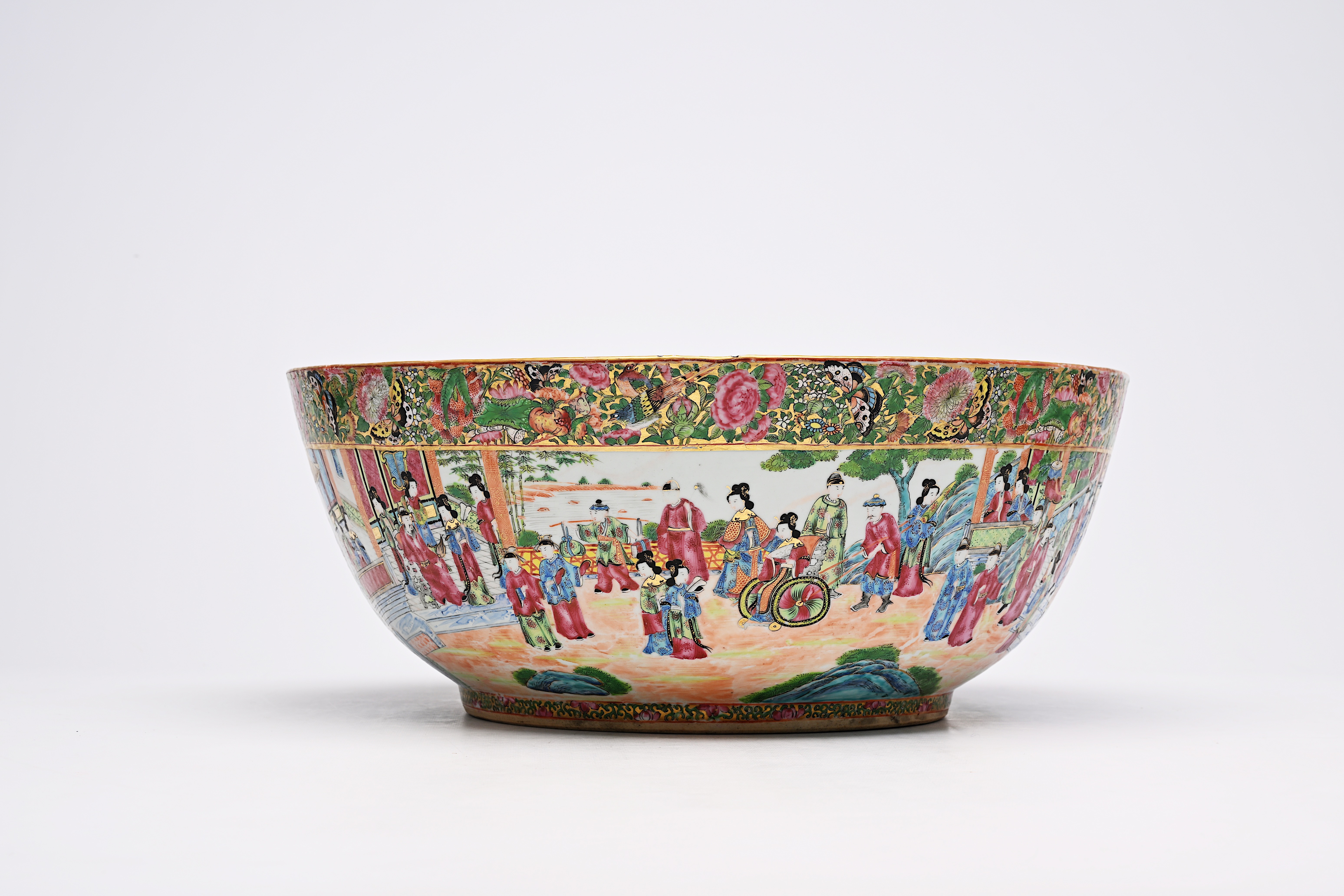 A large Chinese Canton famille rose bowl with floral design and palace scenes, 19th C. - Image 4 of 9