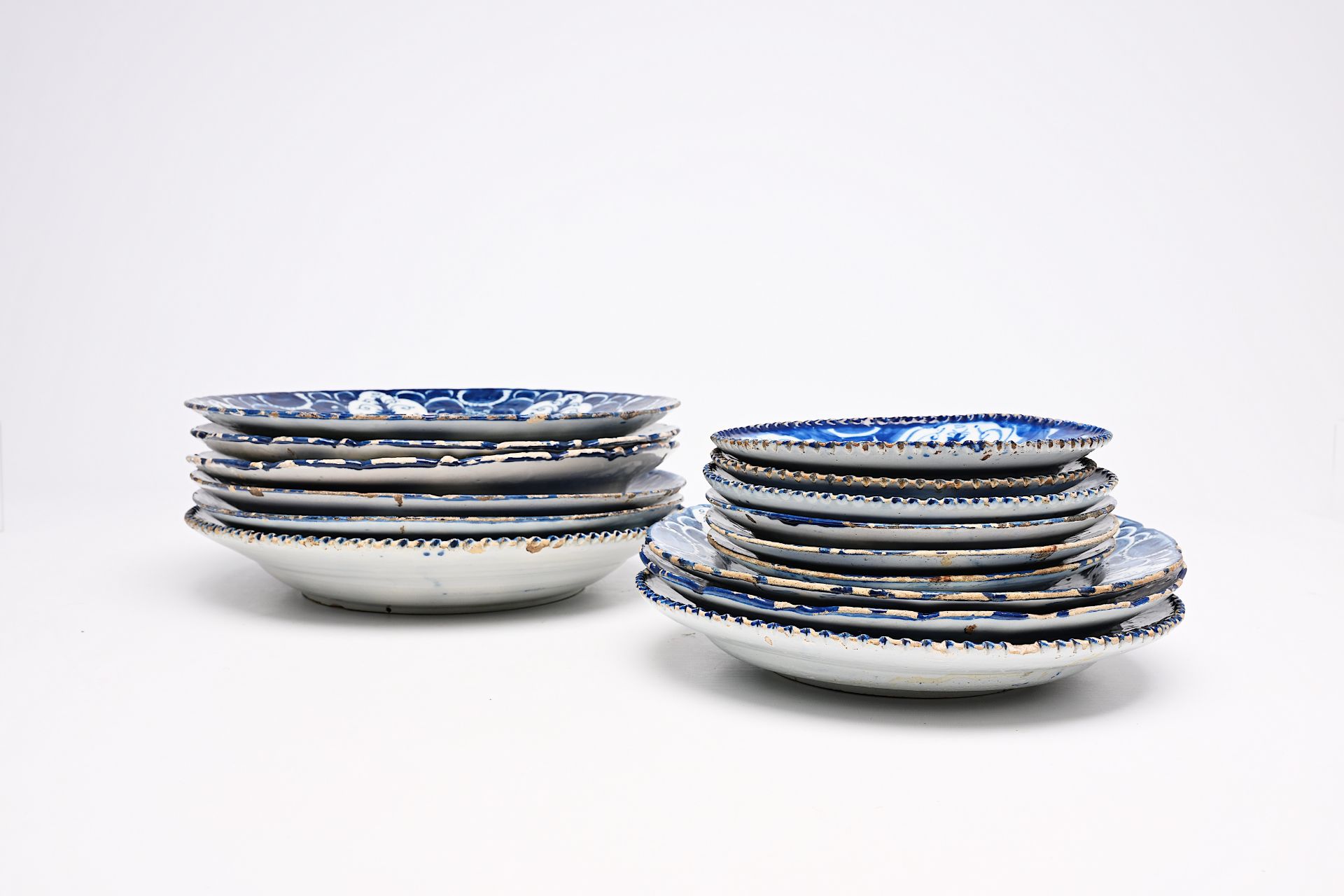 A varied collection of Dutch Delft blue and white plates and dishes with floral design, 18th C. - Image 5 of 8