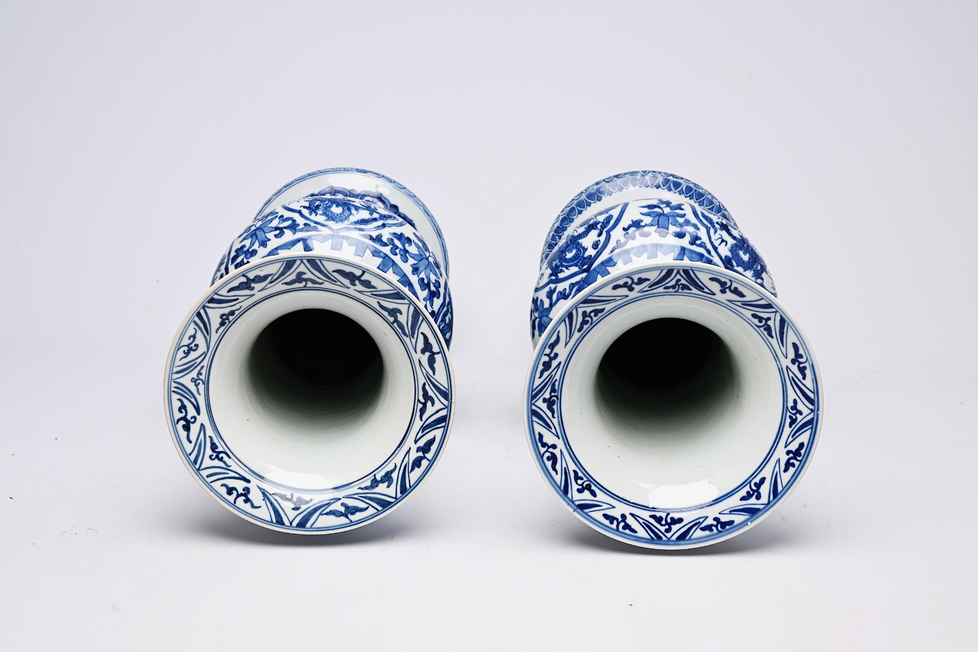 A pair of Chinese blue and white 'gu' vases with dragons and floral design, Qianlong mark, Republic, - Image 18 of 22