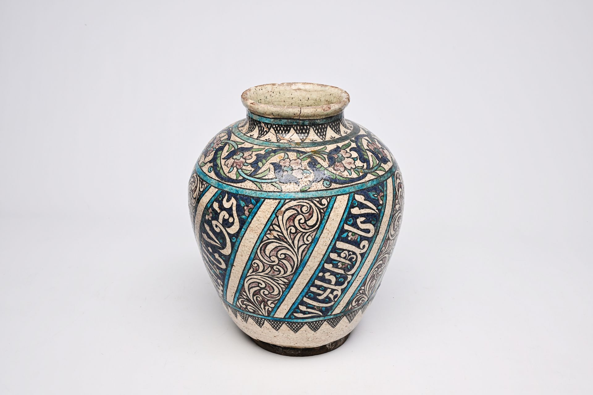 A polychrome pottery jar with floral and calligraphic design, Iran, 19th C. - Image 9 of 9