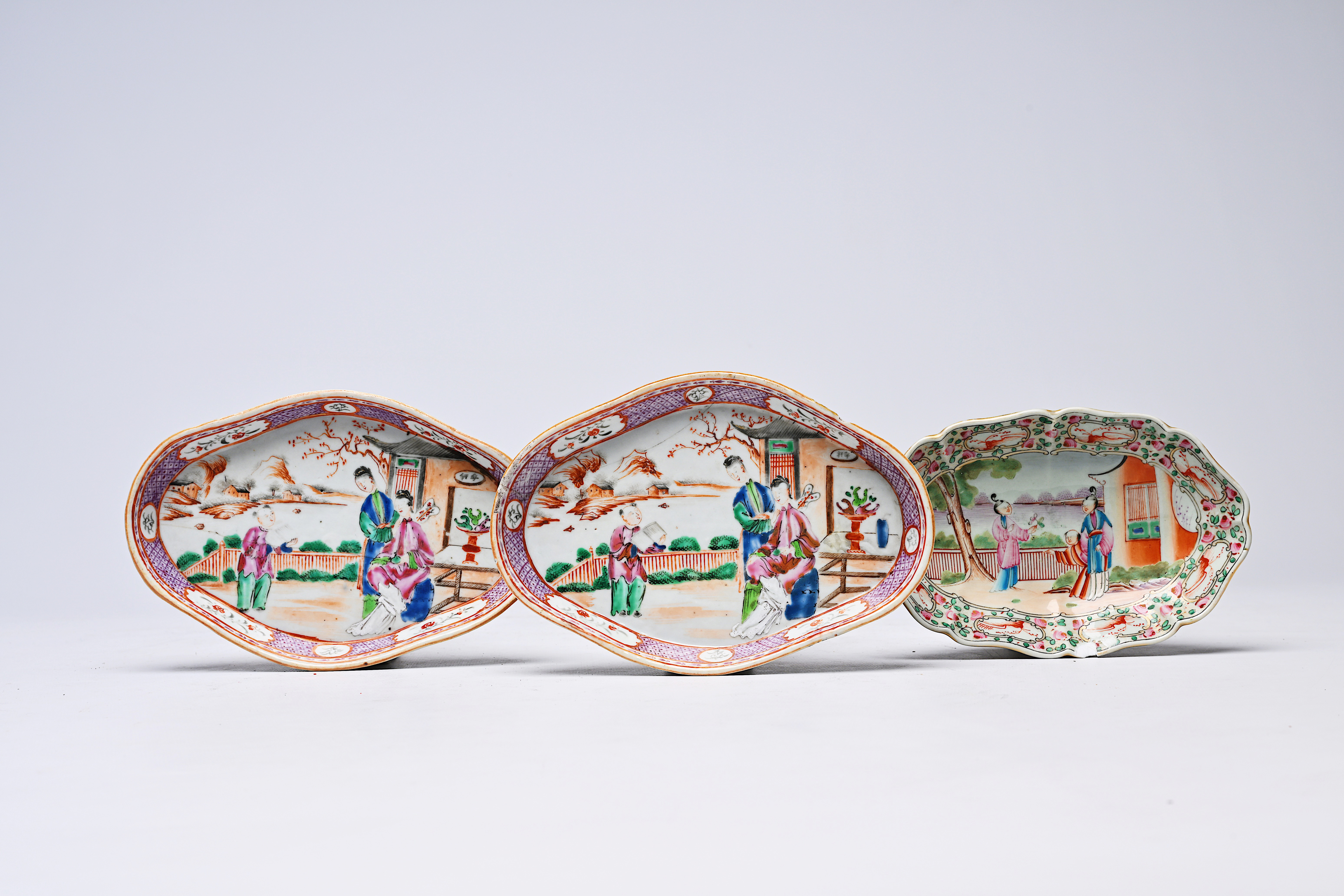 Three Chinese famille rose 'mandarin subject' spoon trays, 18th/19th C.