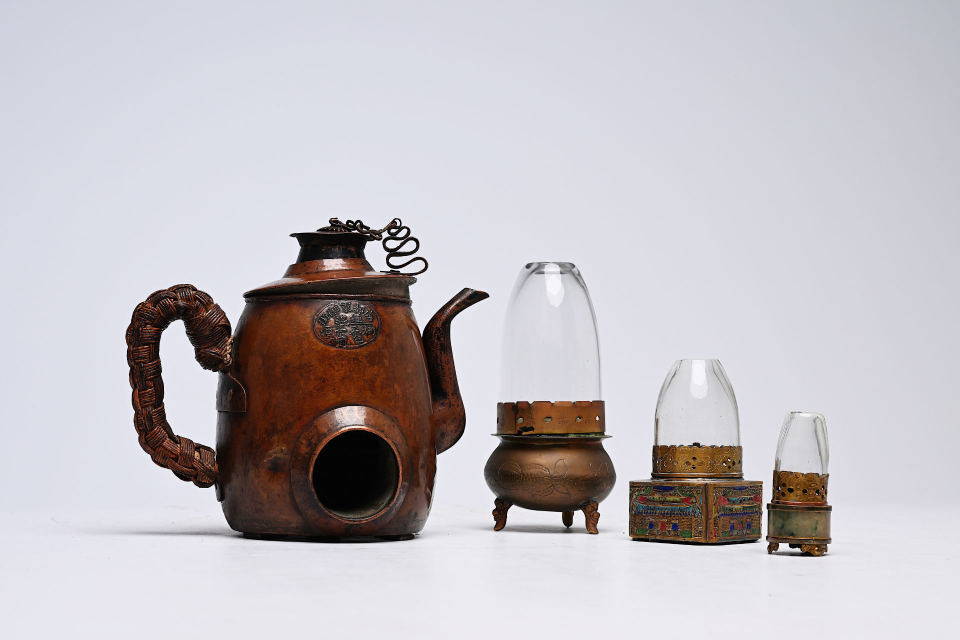 Three Chinese brass opium lamps and a wine warmer, Republic