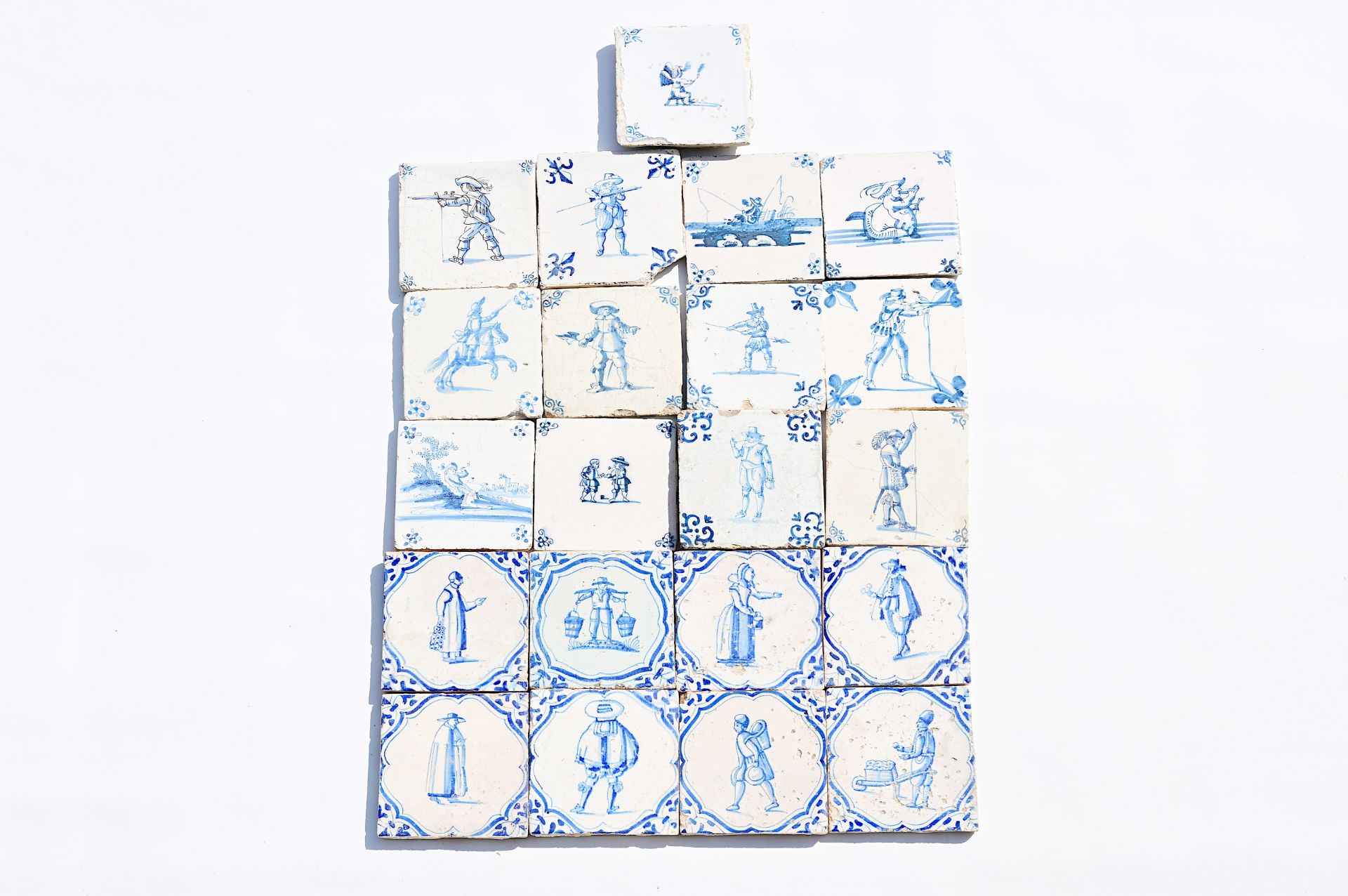Twenty-one Dutch Delft blue and white 'figure' tiles, 17th/18th C.