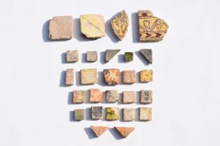 A varied collection of medieval tile fragments, 12th/16th C.