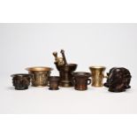 Six bronze mortars, five stampers and a patinated cast iron ram's head, 16th C. and later