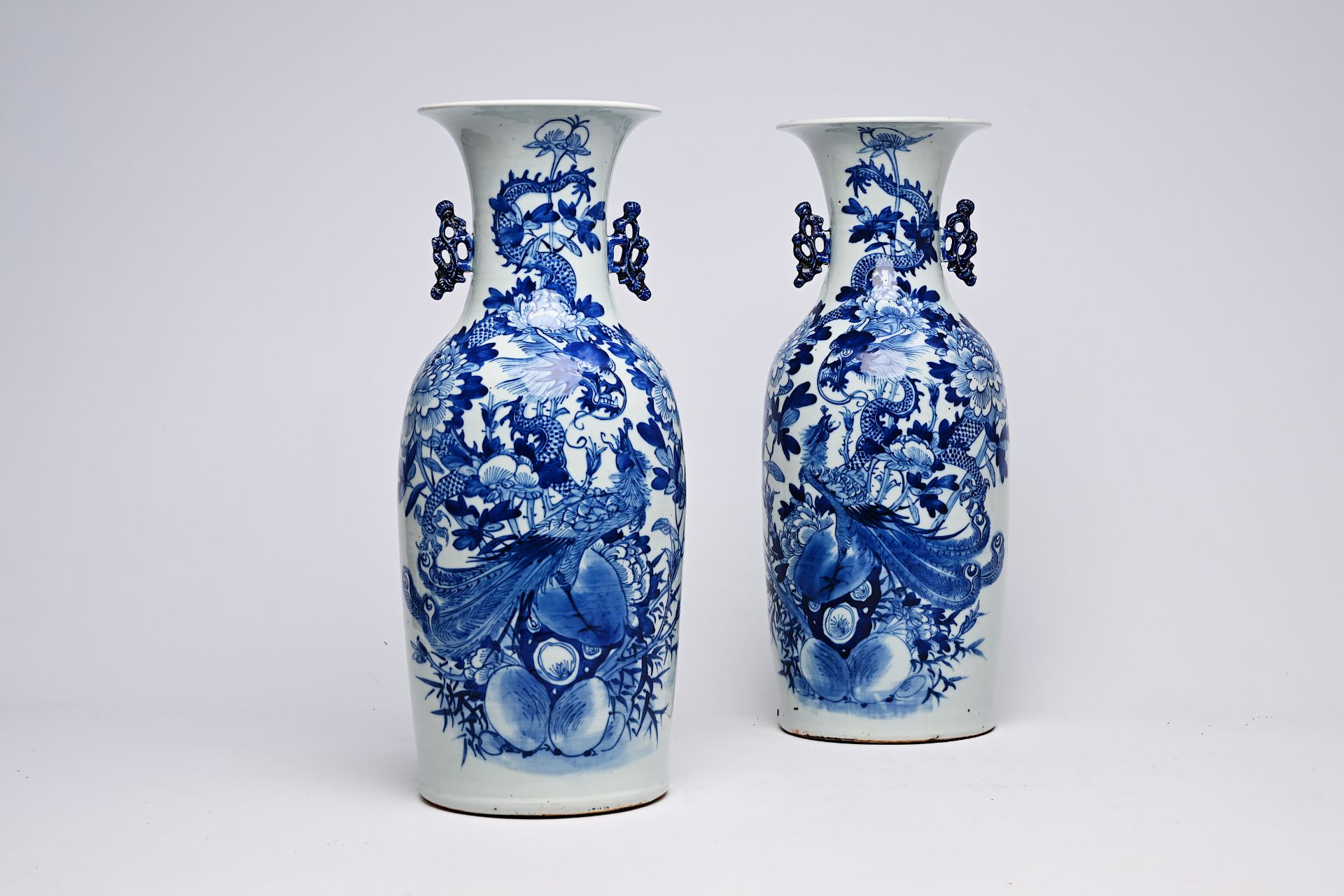 A pair of Chinese blue and white celadon ground vases with a dragon and a phoenix among blossoming b - Image 21 of 28